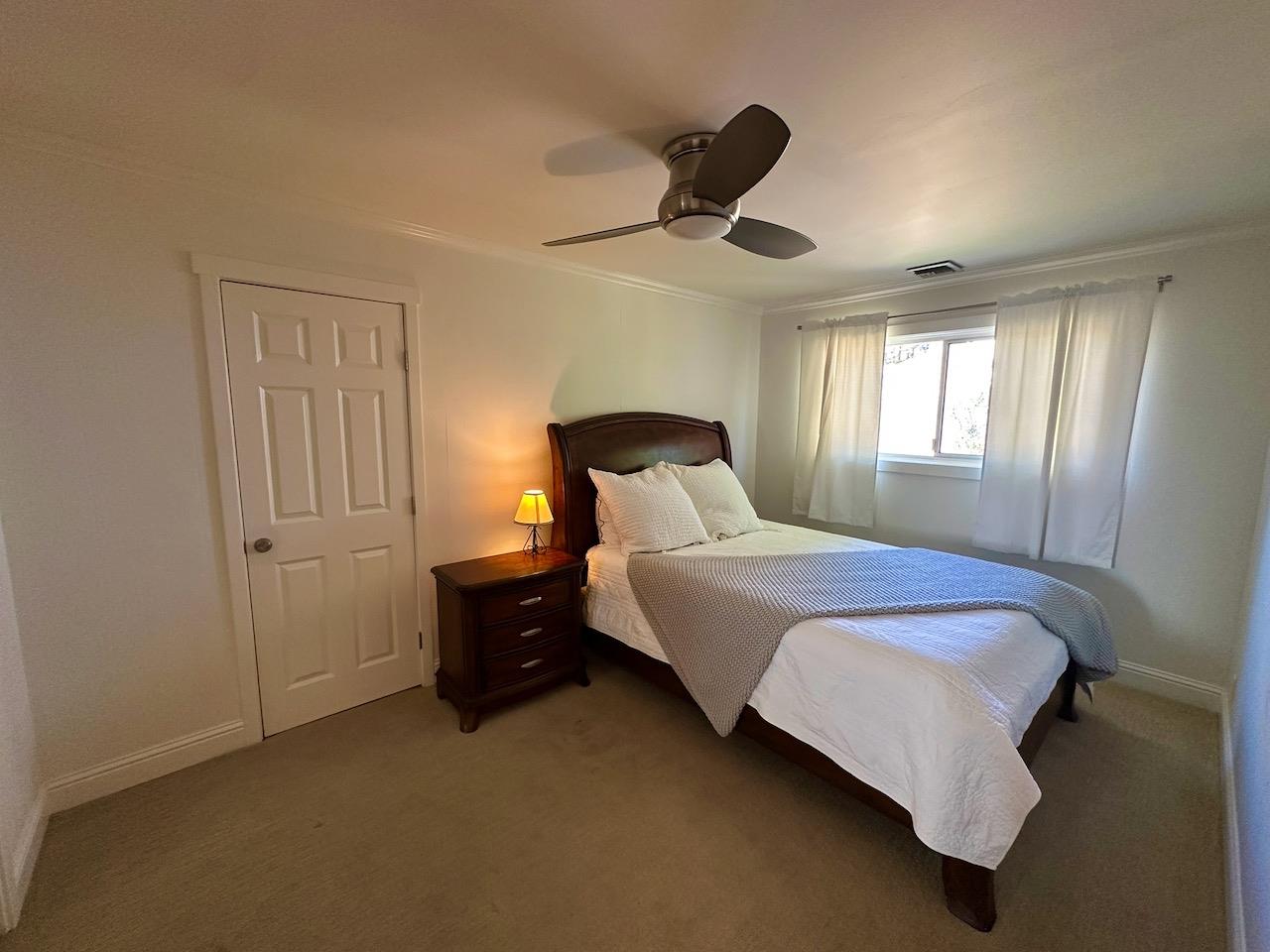 466 Thomson Lane Copperopolis, CA 95228 - Photo 28 of 47 a bedroom with a bed and window