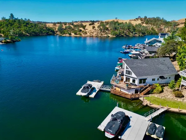 an aerial view of a house with a ocean view
