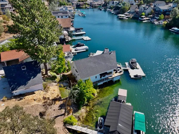 an aerial view of house with yard swimming pool and outdoor seating