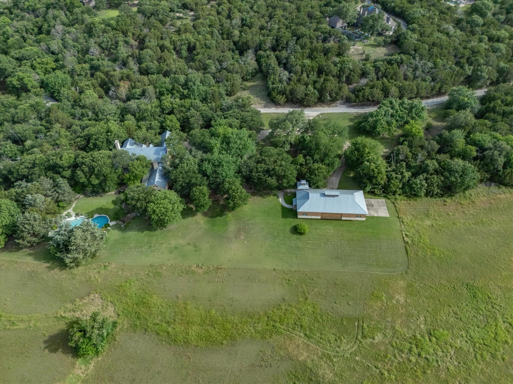 151 Trinity Bluffs Road Aledo, TX 76008 - Photo 39 of 40 a backyard of a house with a yard and lake view