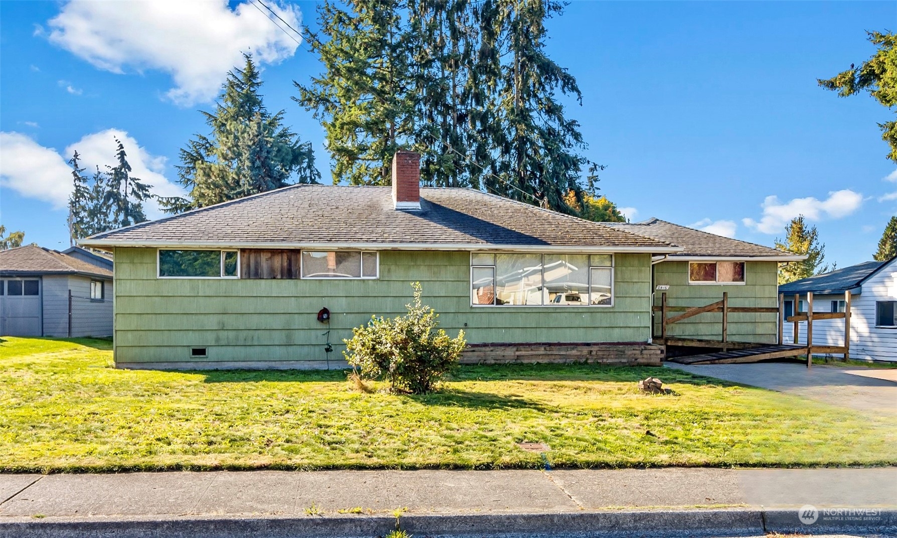 2416 6th Street Everett, WA 98201 - Photo 1 of 36 a front view of a house with a yard
