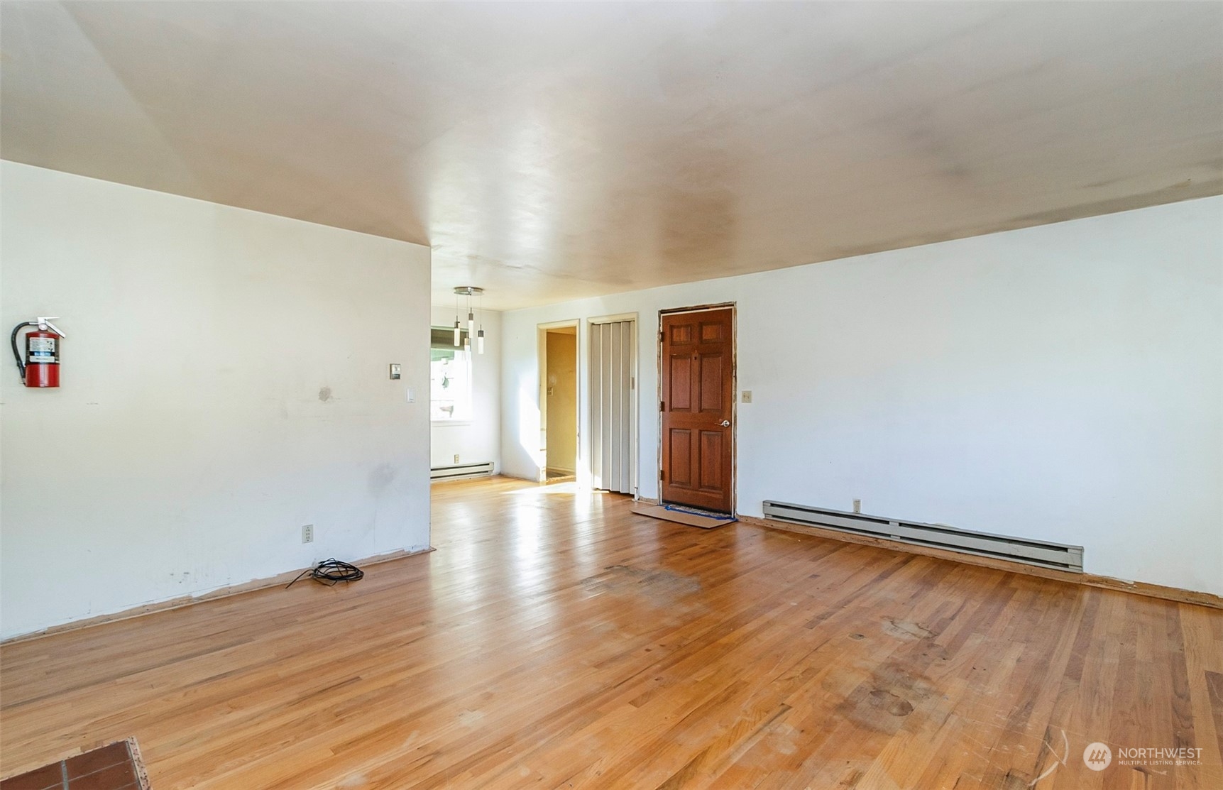 2416 6th Street Everett, WA 98201 - Photo 14 of 36 a view of an empty room and wooden floor