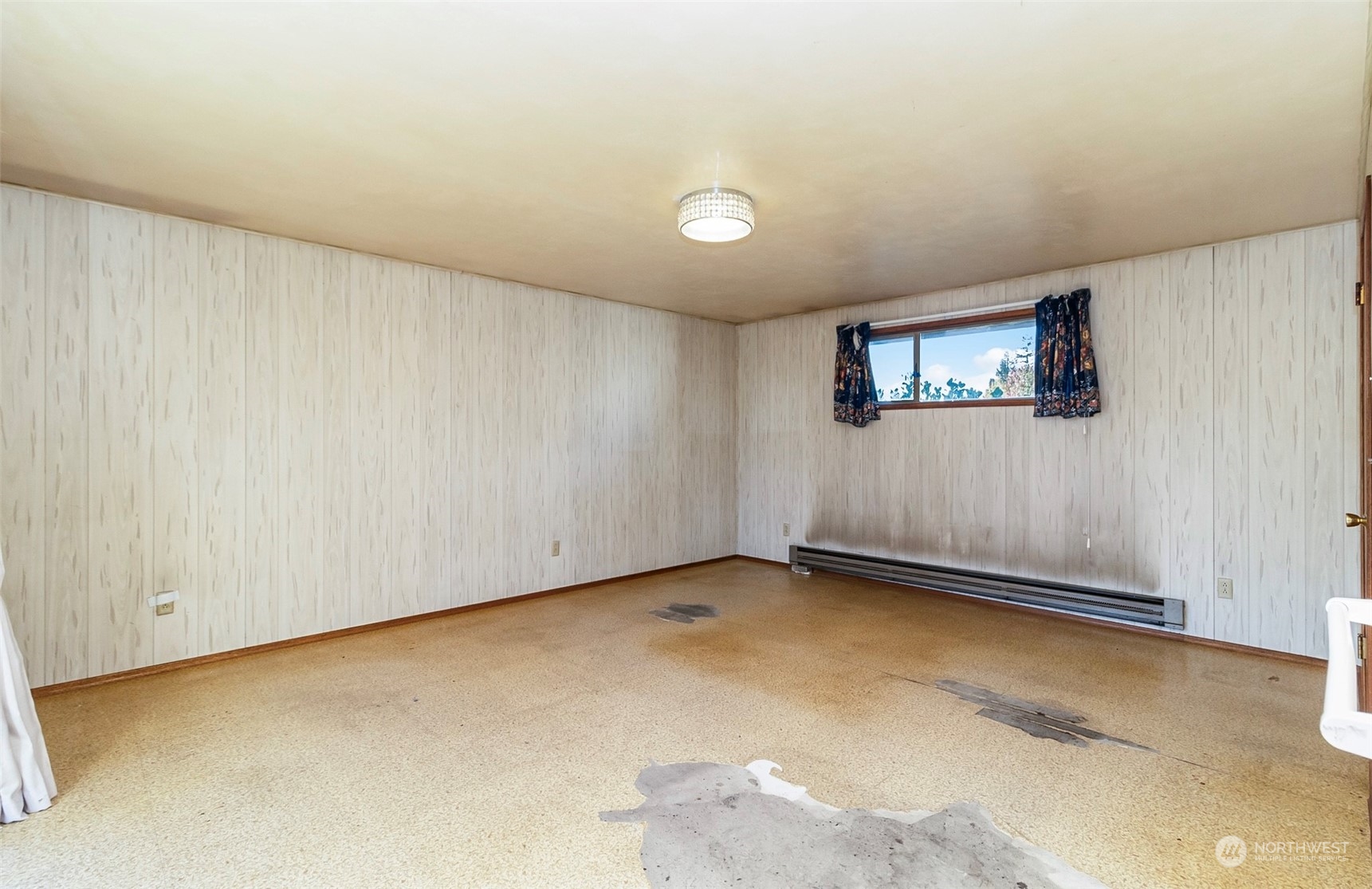 2416 6th Street Everett, WA 98201 - Photo 20 of 36 a view of an empty room with a window