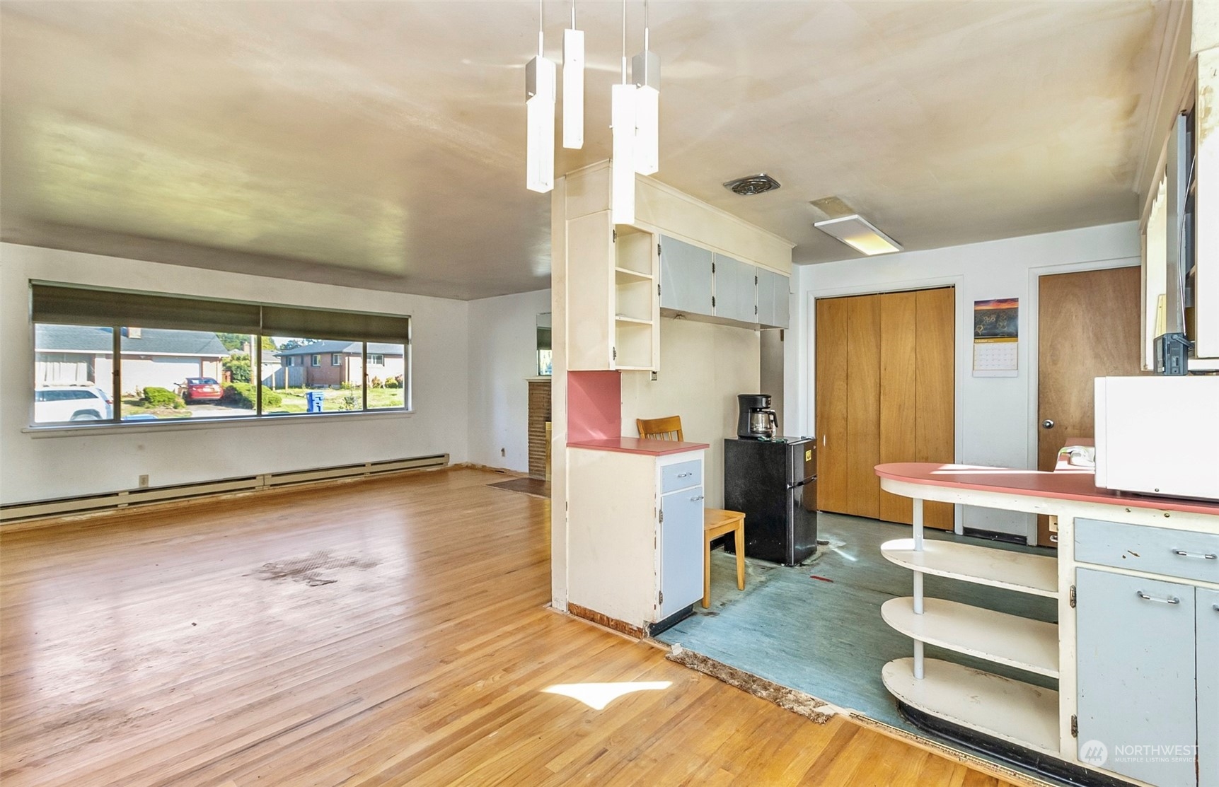 2416 6th Street Everett, WA 98201 - Photo 26 of 36 a view of kitchen and hall with wooden floor