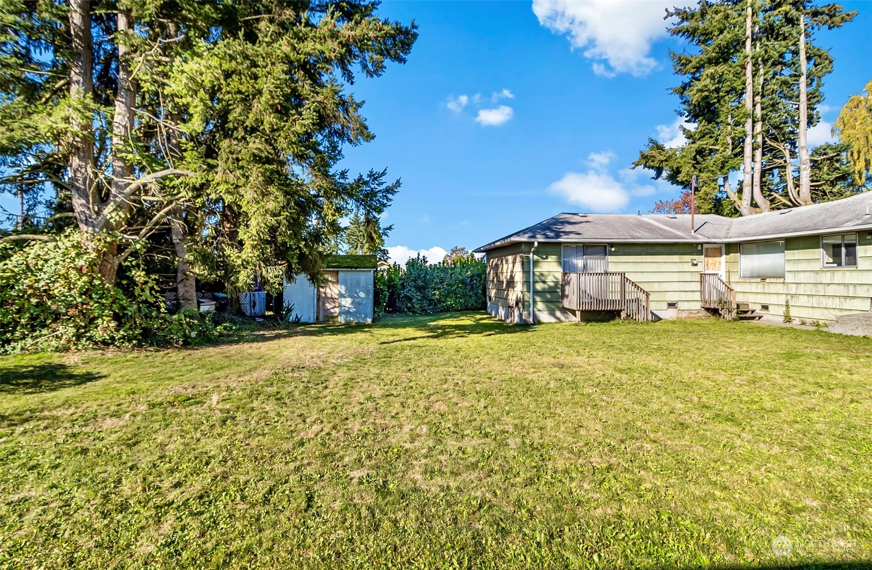 2416 6th Street Everett, WA 98201 - Photo 32 of 36 a view of a house with a yard and sitting area