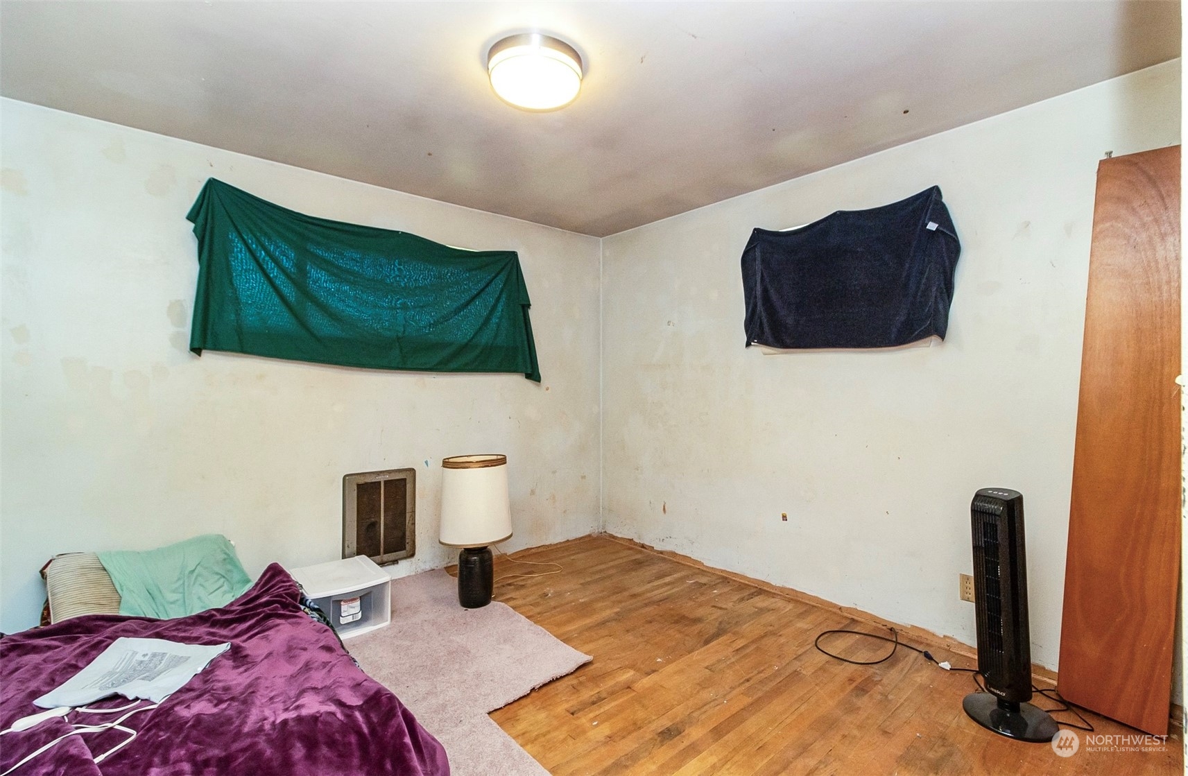 2416 6th Street Everett, WA 98201 - Photo 5 of 36 a bedroom with a bed and flat screen tv