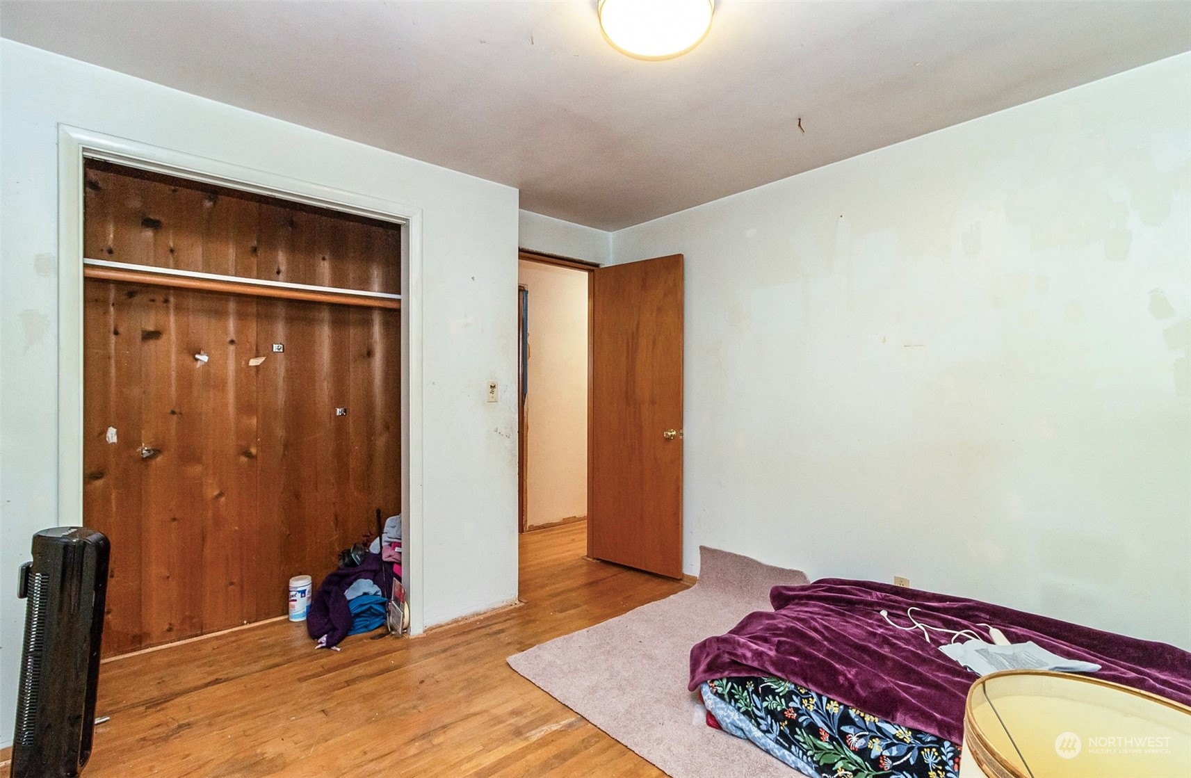 2416 6th Street Everett, WA 98201 - Photo 6 of 36 a bedroom with a bed and a dresser