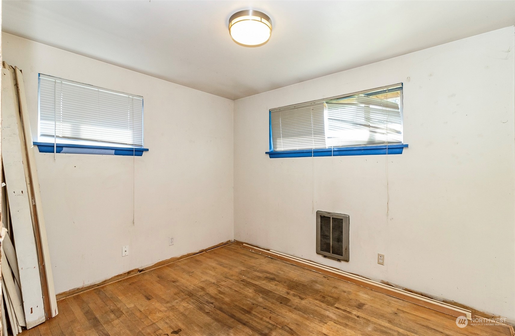 2416 6th Street Everett, WA 98201 - Photo 7 of 36 a view of empty room with wooden floor and fan