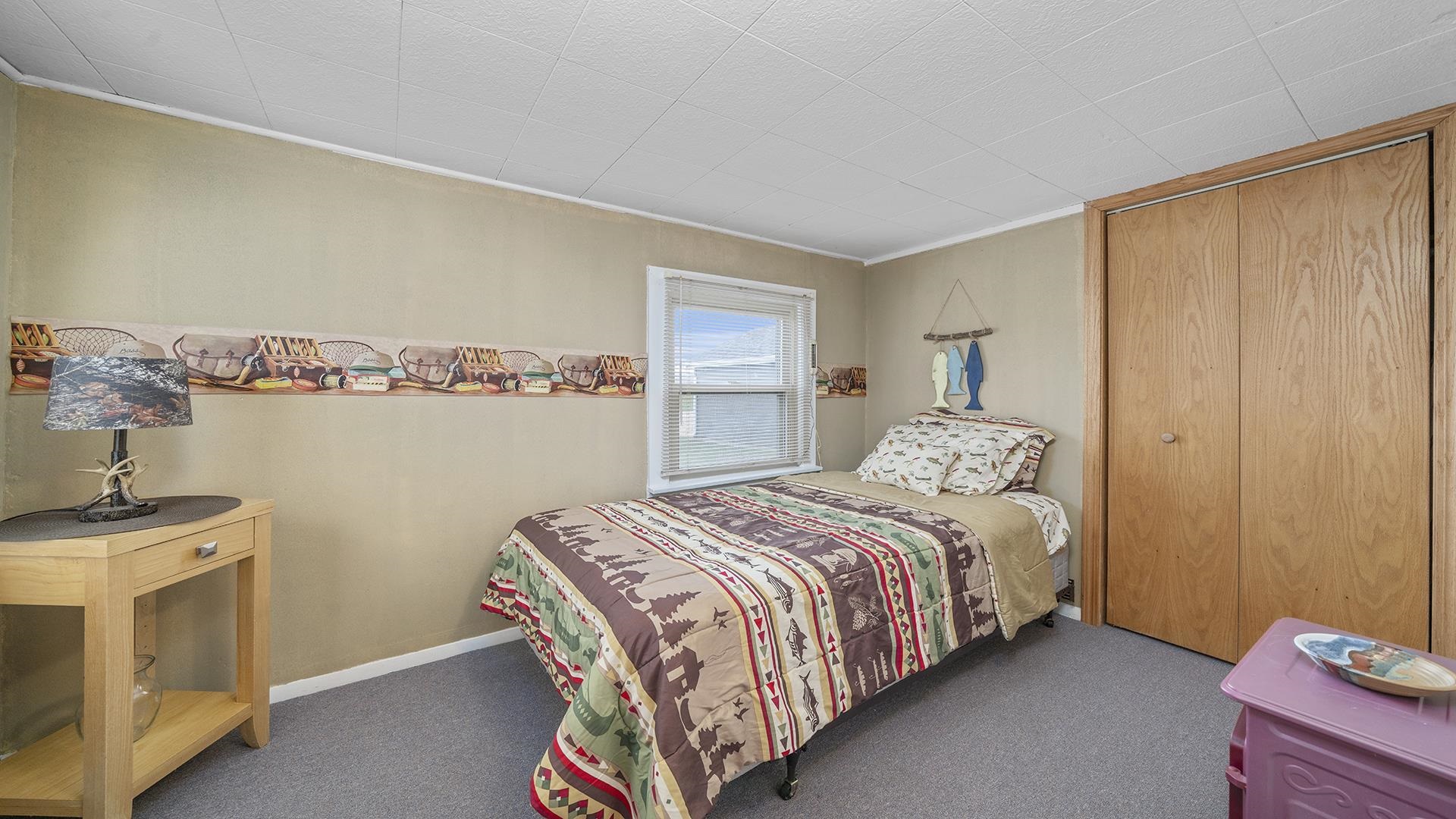 2687 South Snyder Road Oregon, IL 61061 - Photo 12 of 33 a bedroom with a bed and a cabinets