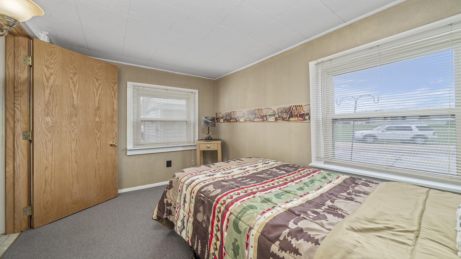 2687 South Snyder Road Oregon, IL 61061 - Photo 13 of 33 a bedroom with a bed and a window