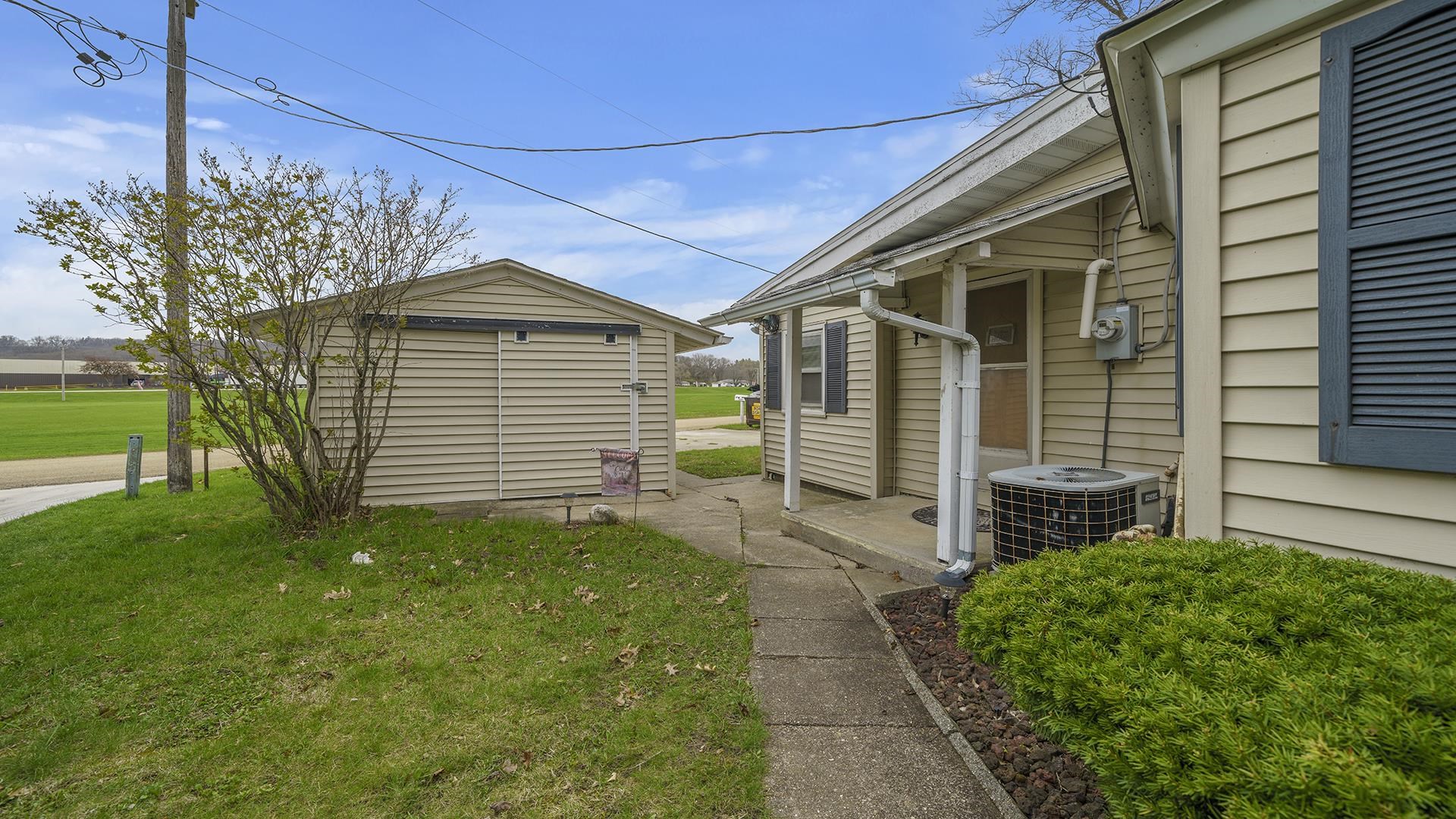 2687 South Snyder Road Oregon, IL 61061 - Photo 23 of 33 a front view of a house with garden
