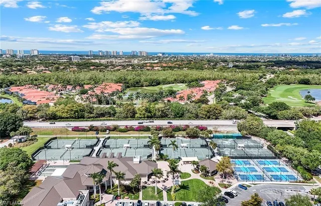 an aerial view of house with yard and lake view