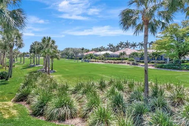 a view of a garden with a building in the background