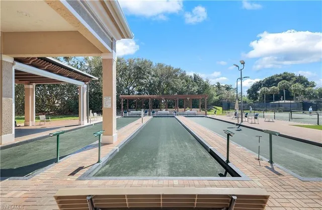 a view of swimming pool with a sitting area