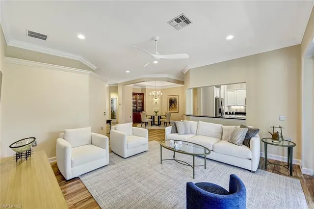 a roof deck with table and chairs