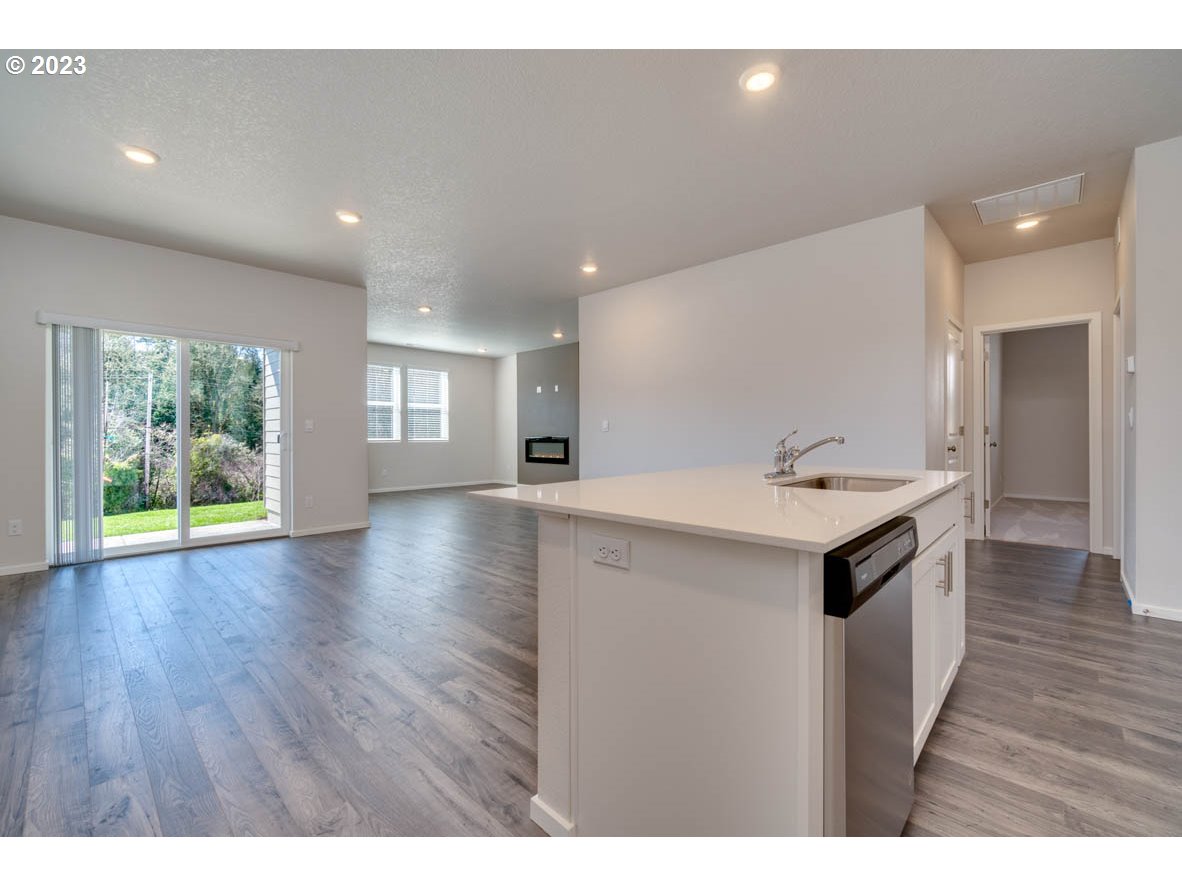 3492 Southeast Olvera Avenue Gresham, OR 97080 - Photo 11 of 23 a kitchen with a sink and wooden floor