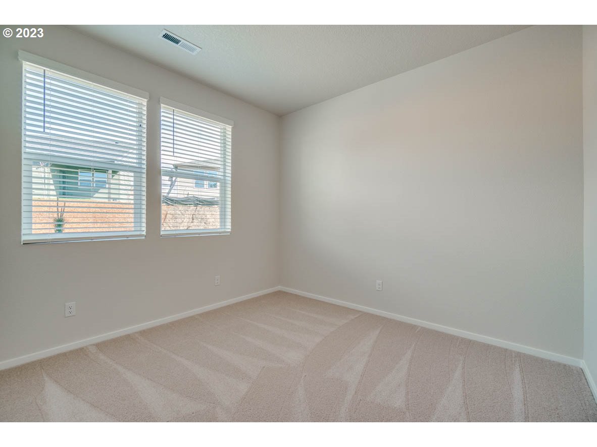 3492 Southeast Olvera Avenue Gresham, OR 97080 - Photo 4 of 23 a view of an empty room with a window
