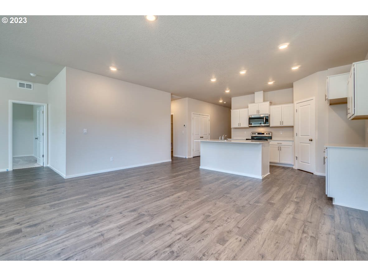 3492 Southeast Olvera Avenue Gresham, OR 97080 - Photo 10 of 23 a view of kitchen with wooden floor
