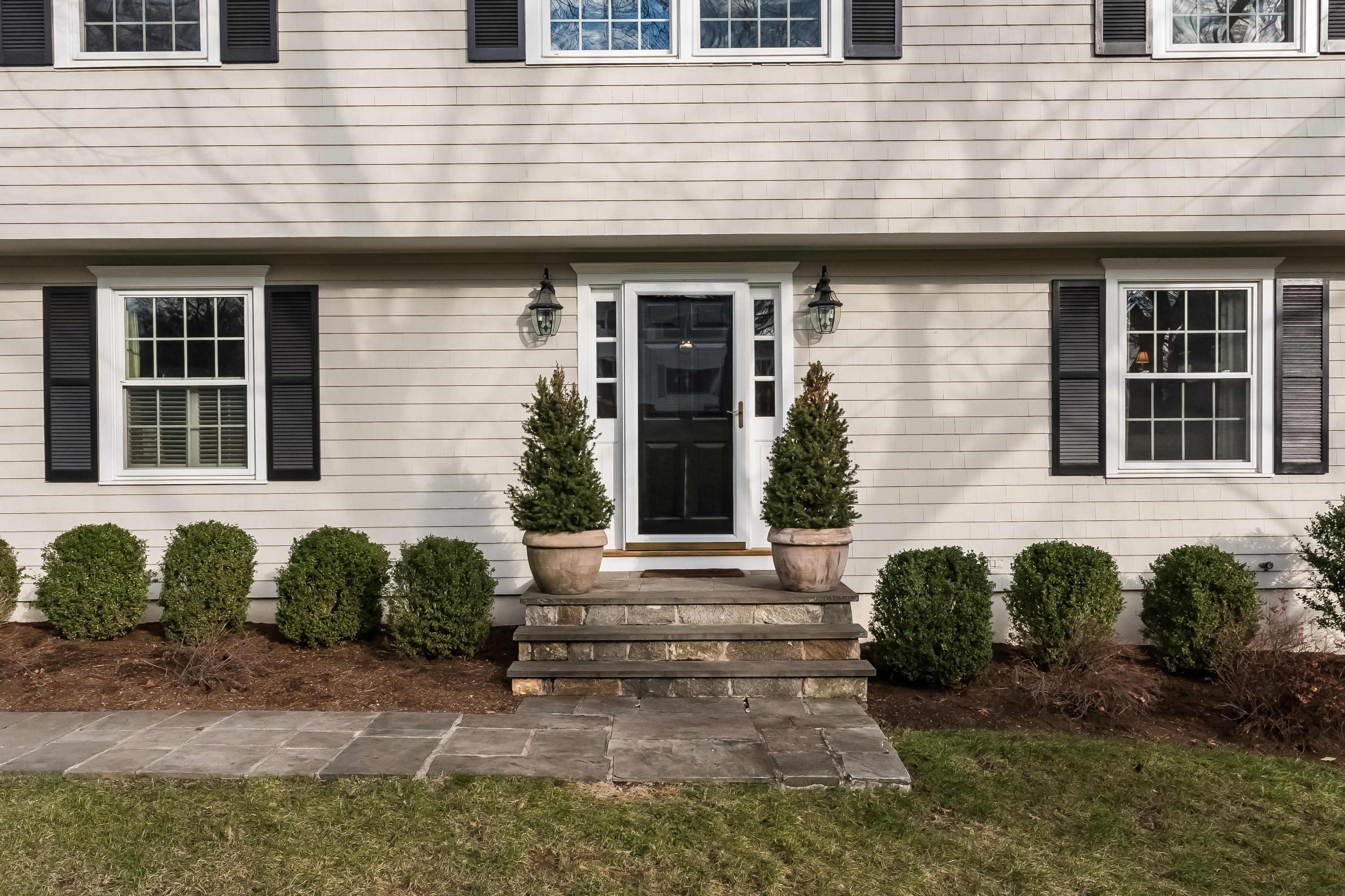 15 Wilson Ridge Road Darien, CT 06820 - Photo 3 of 42 a front view of a house with garden