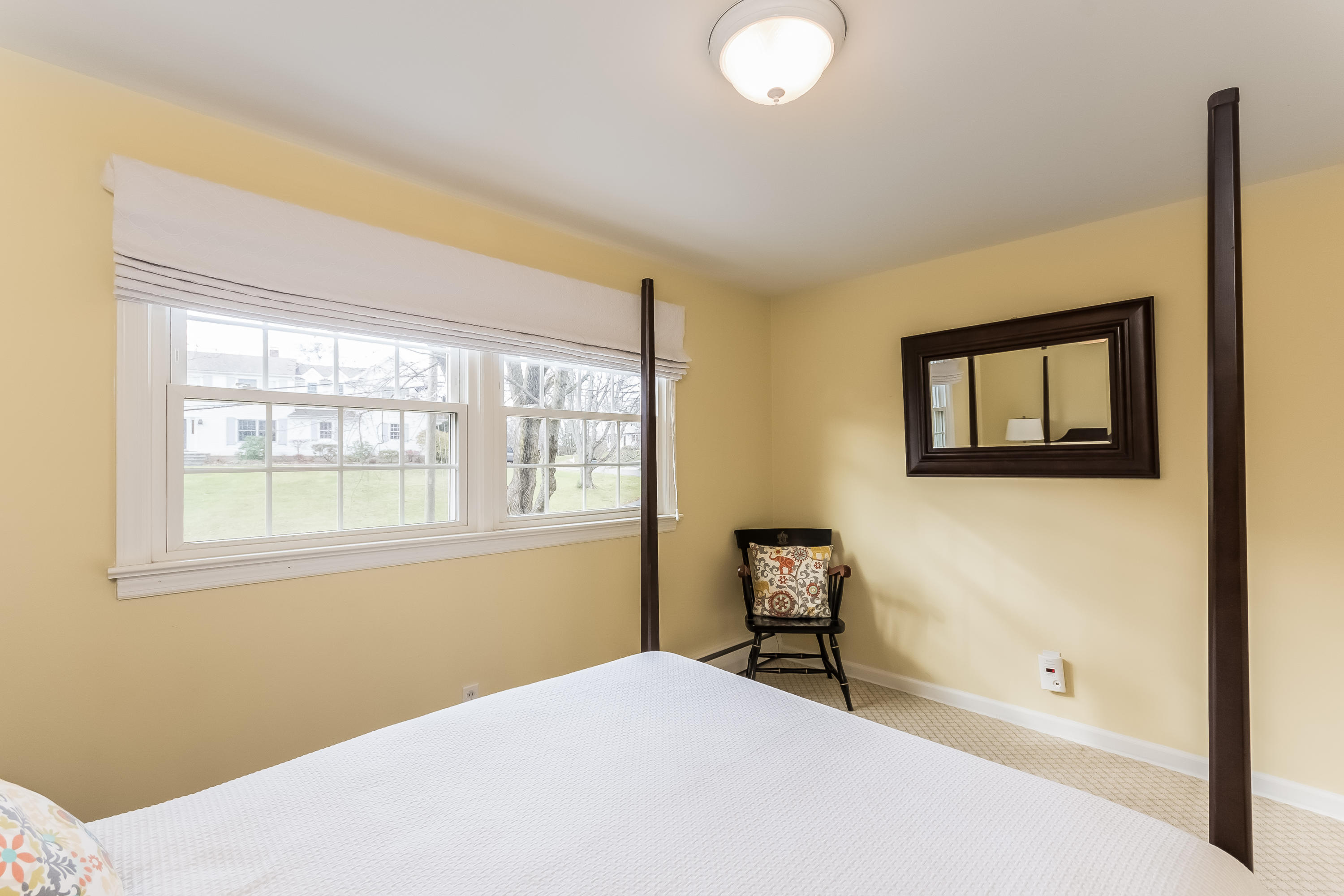15 Wilson Ridge Road Darien, CT 06820 - Photo 22 of 42 a bedroom with a bed and a window
