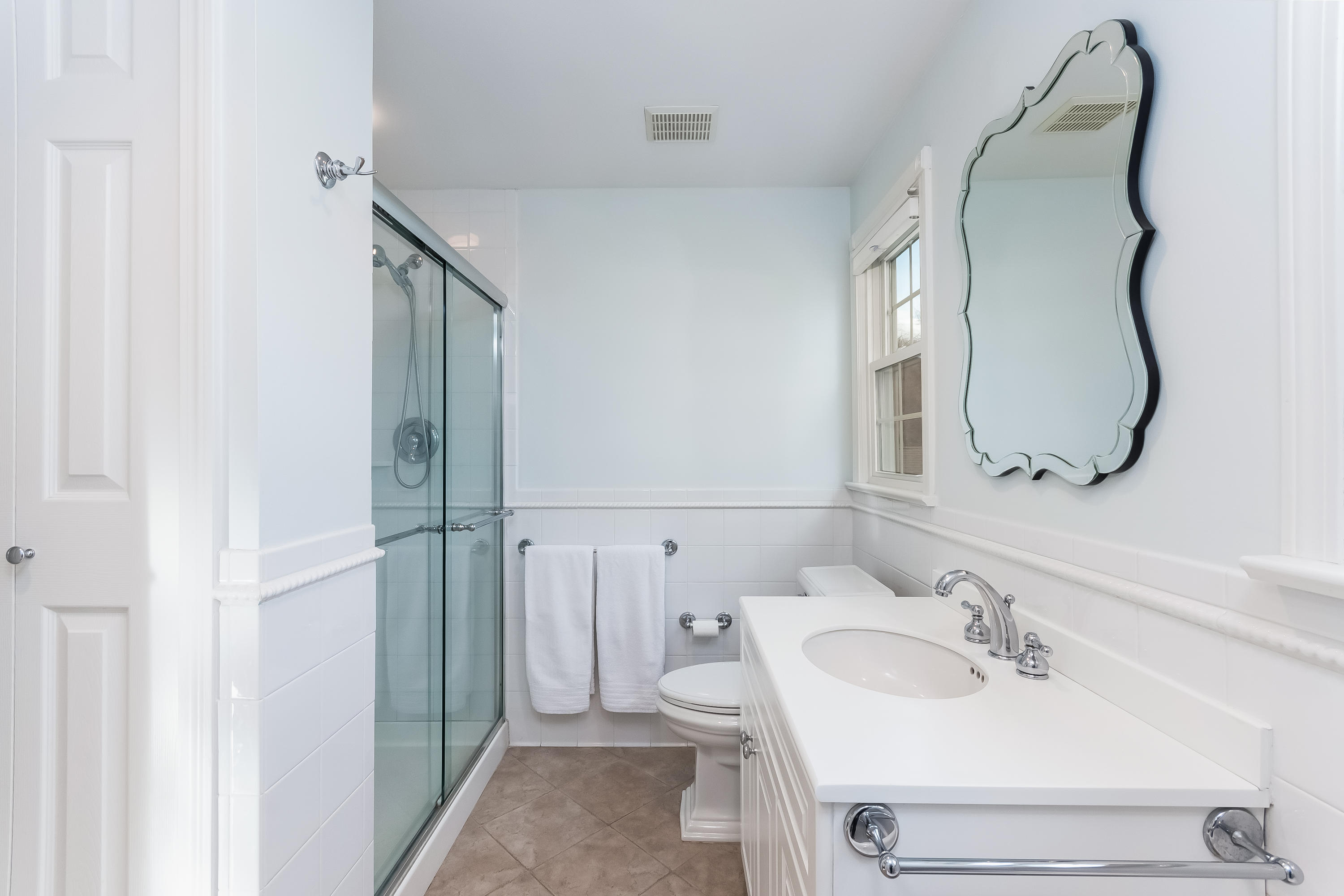 15 Wilson Ridge Road Darien, CT 06820 - Photo 29 of 42 a bathroom with a sink and a mirror