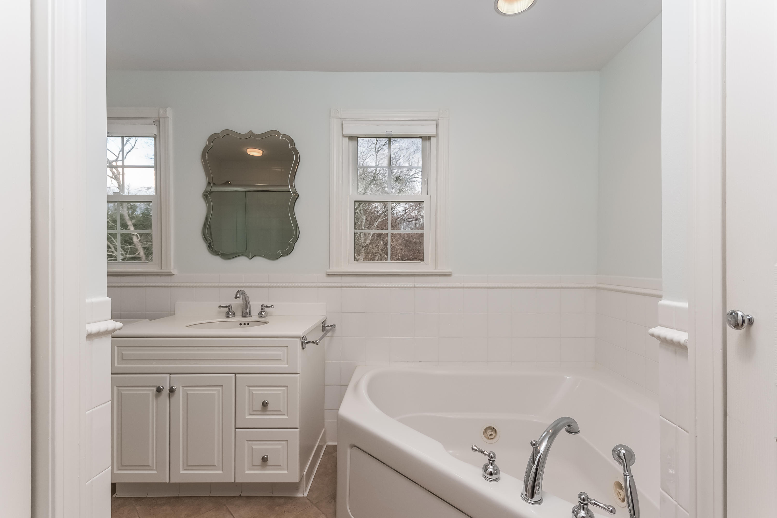 15 Wilson Ridge Road Darien, CT 06820 - Photo 31 of 42 a bathroom with a sink and a mirror