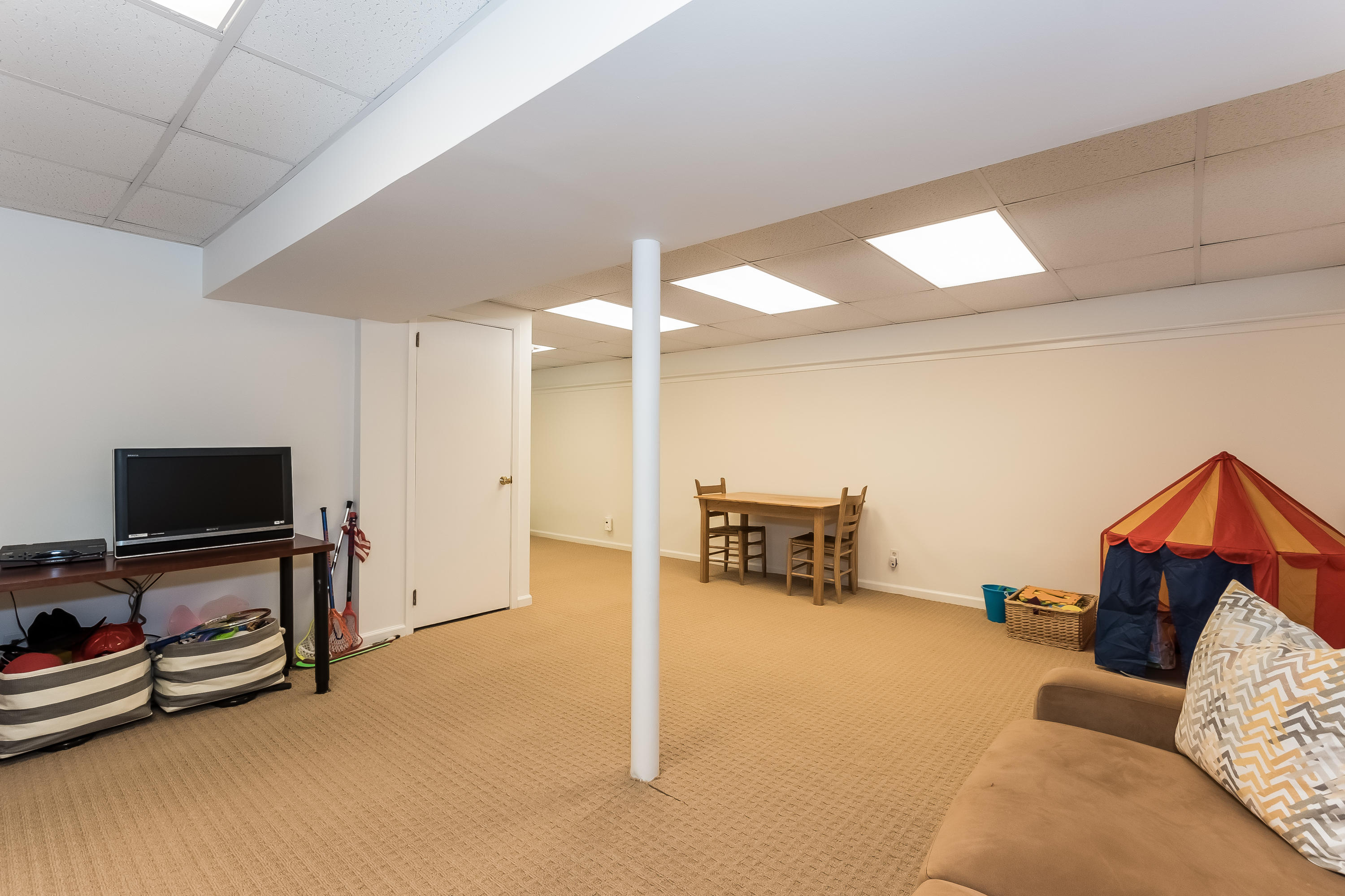 15 Wilson Ridge Road Darien, CT 06820 - Photo 34 of 42 a living room with furniture and a flat screen tv