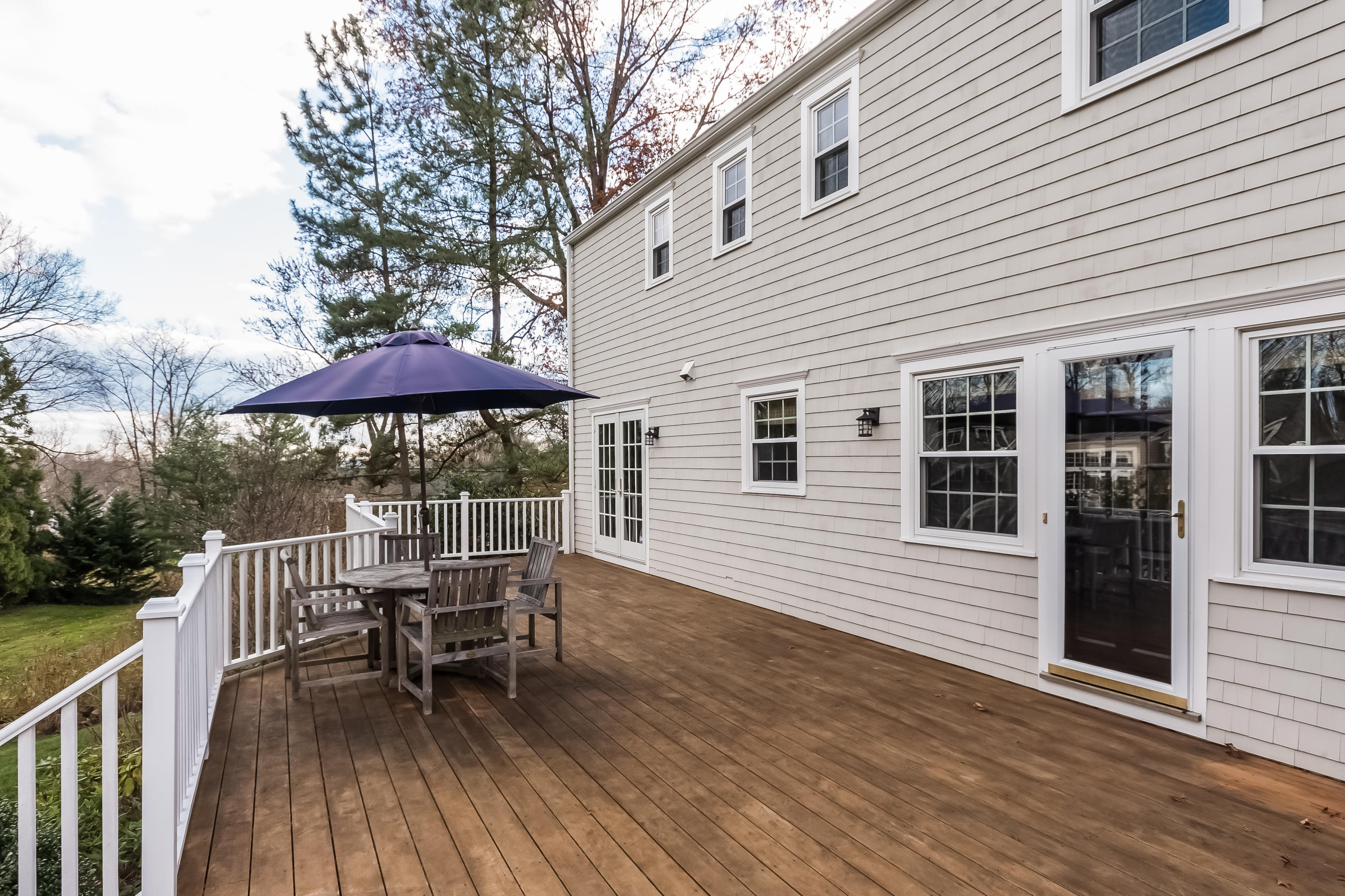 15 Wilson Ridge Road Darien, CT 06820 - Photo 36 of 42 a view of a house with wooden deck and furniture