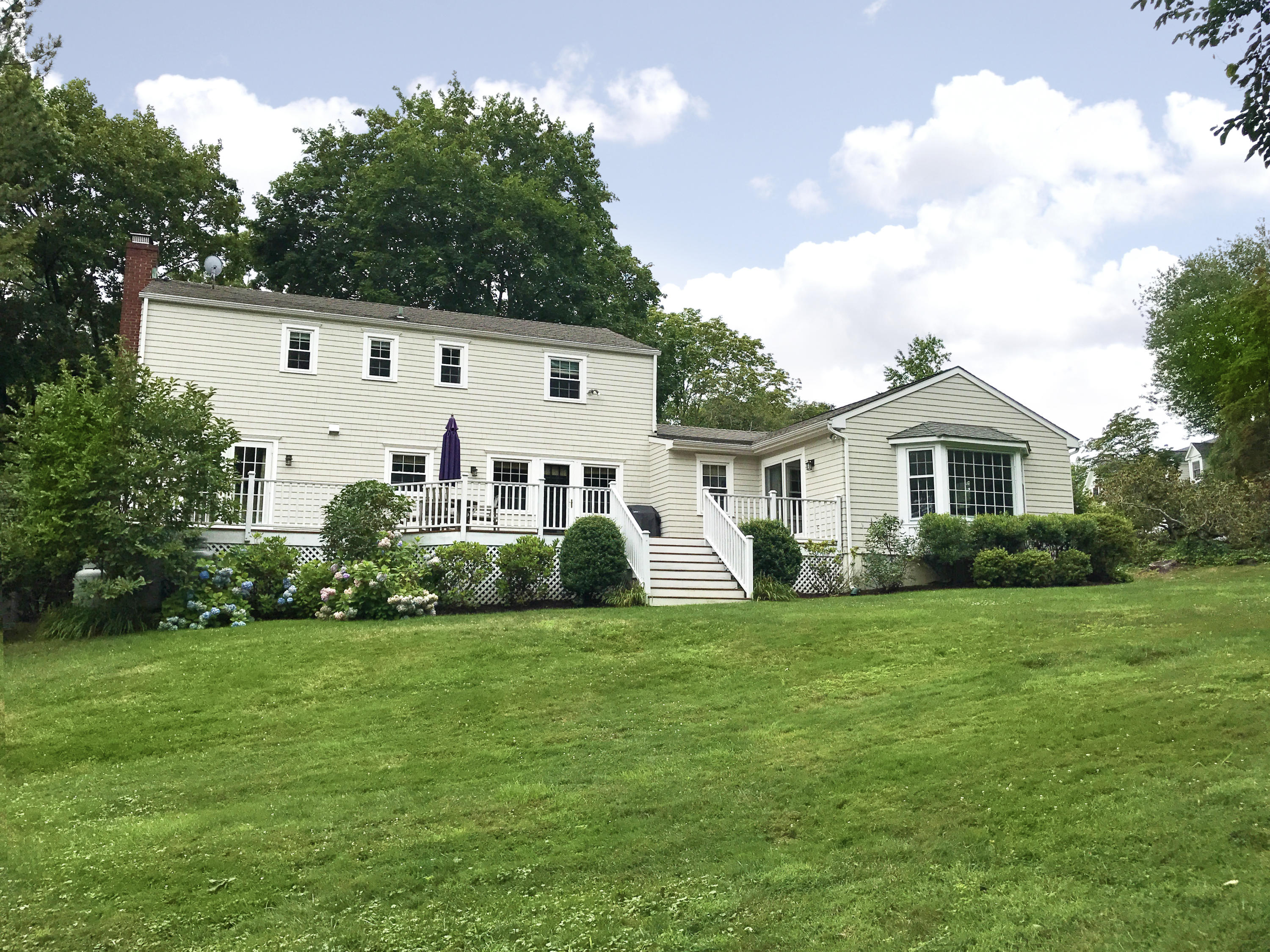 15 Wilson Ridge Road Darien, CT 06820 - Photo 38 of 42 a front view of a house with a yard