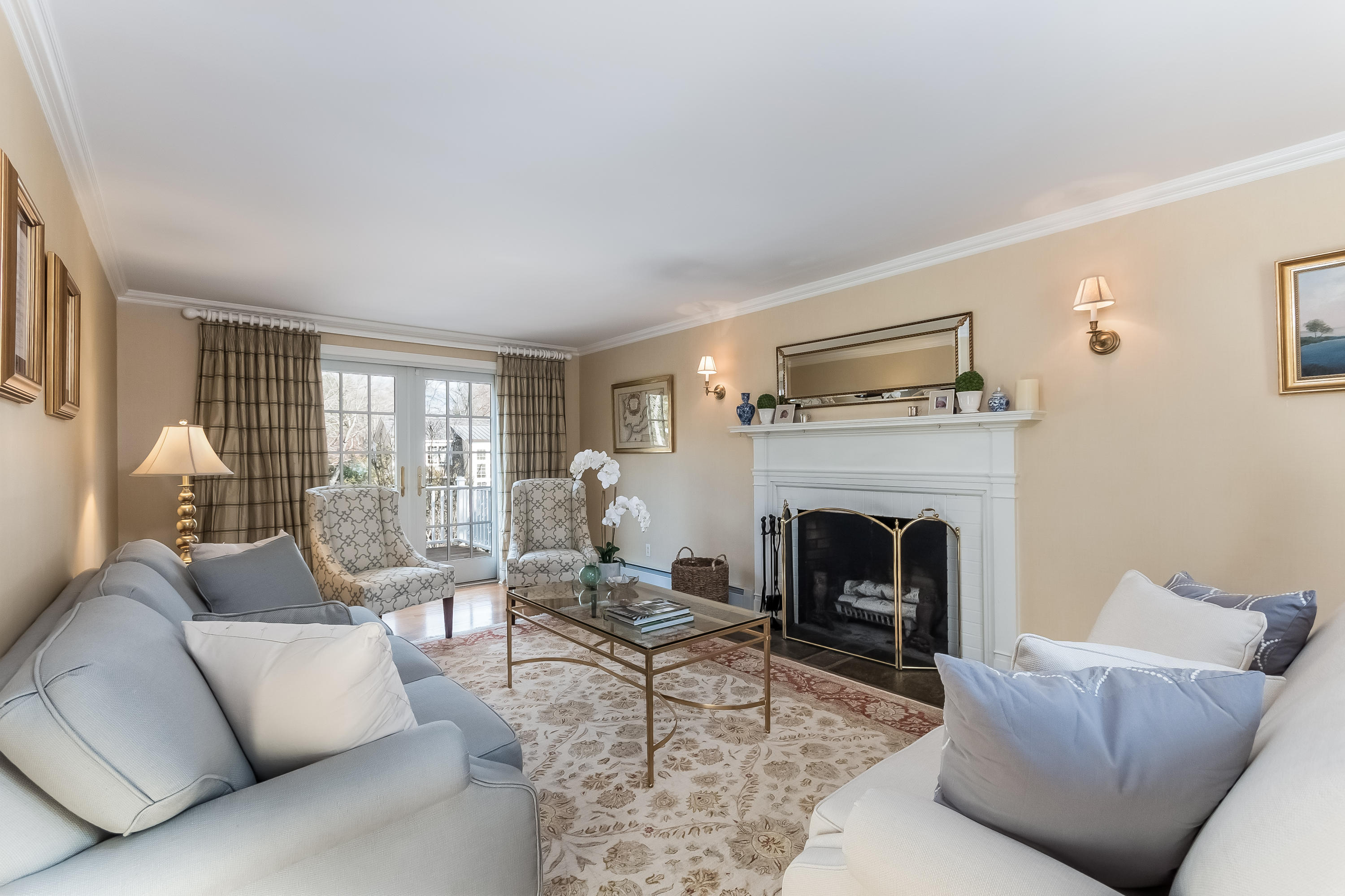 15 Wilson Ridge Road Darien, CT 06820 - Photo 6 of 42 a living room with furniture and a fireplace