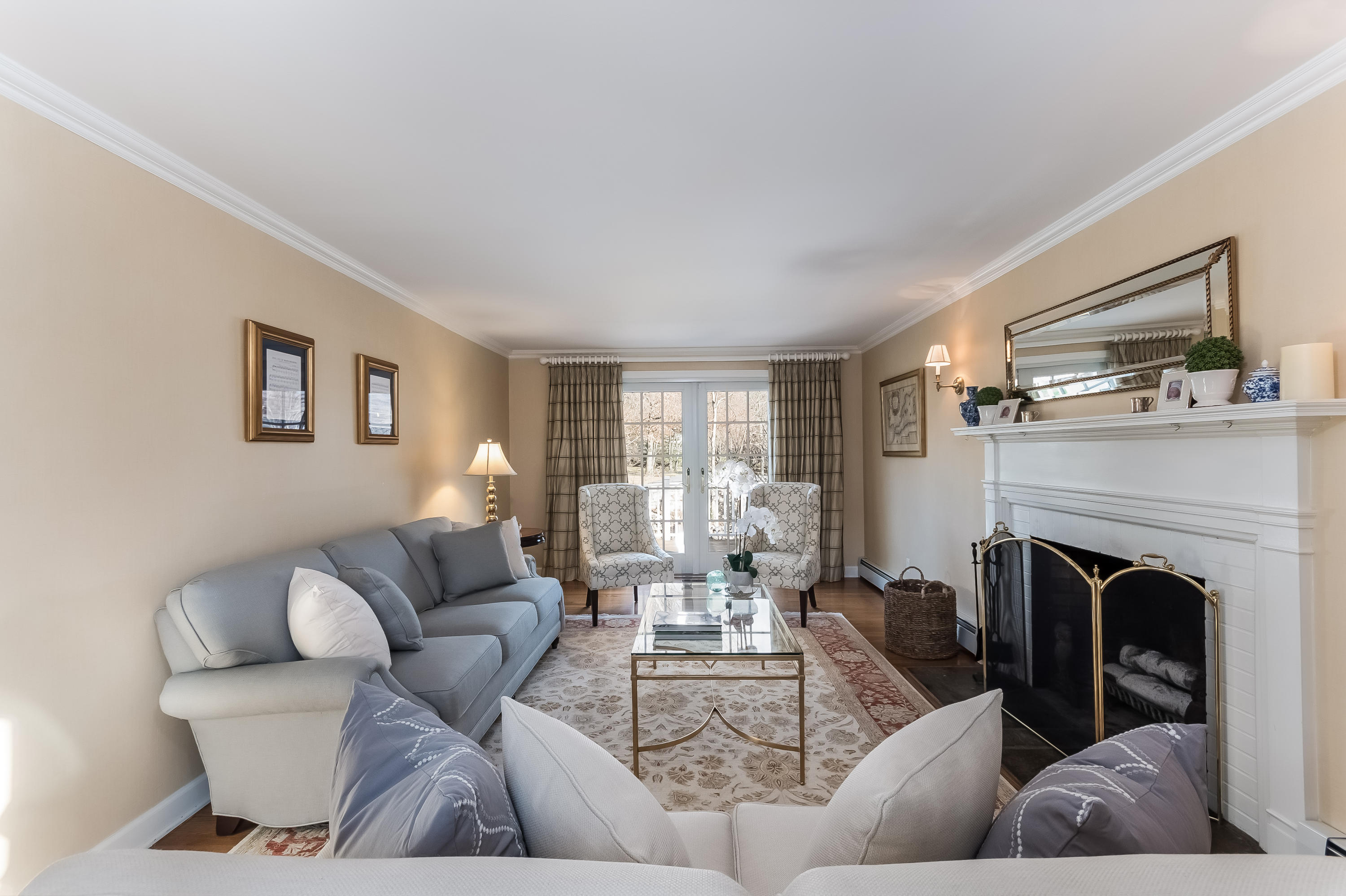 15 Wilson Ridge Road Darien, CT 06820 - Photo 7 of 42 a living room with furniture and a fireplace