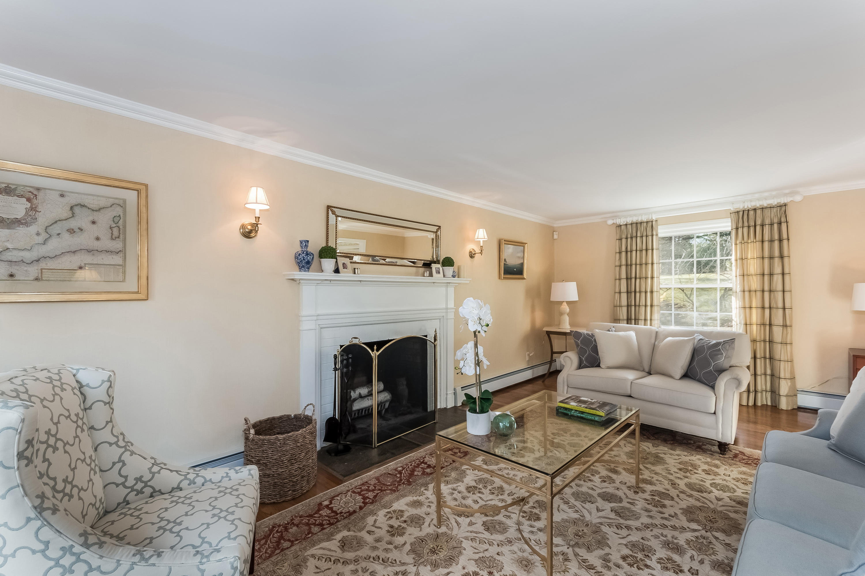 15 Wilson Ridge Road Darien, CT 06820 - Photo 8 of 42 a living room with furniture a rug and a fireplace