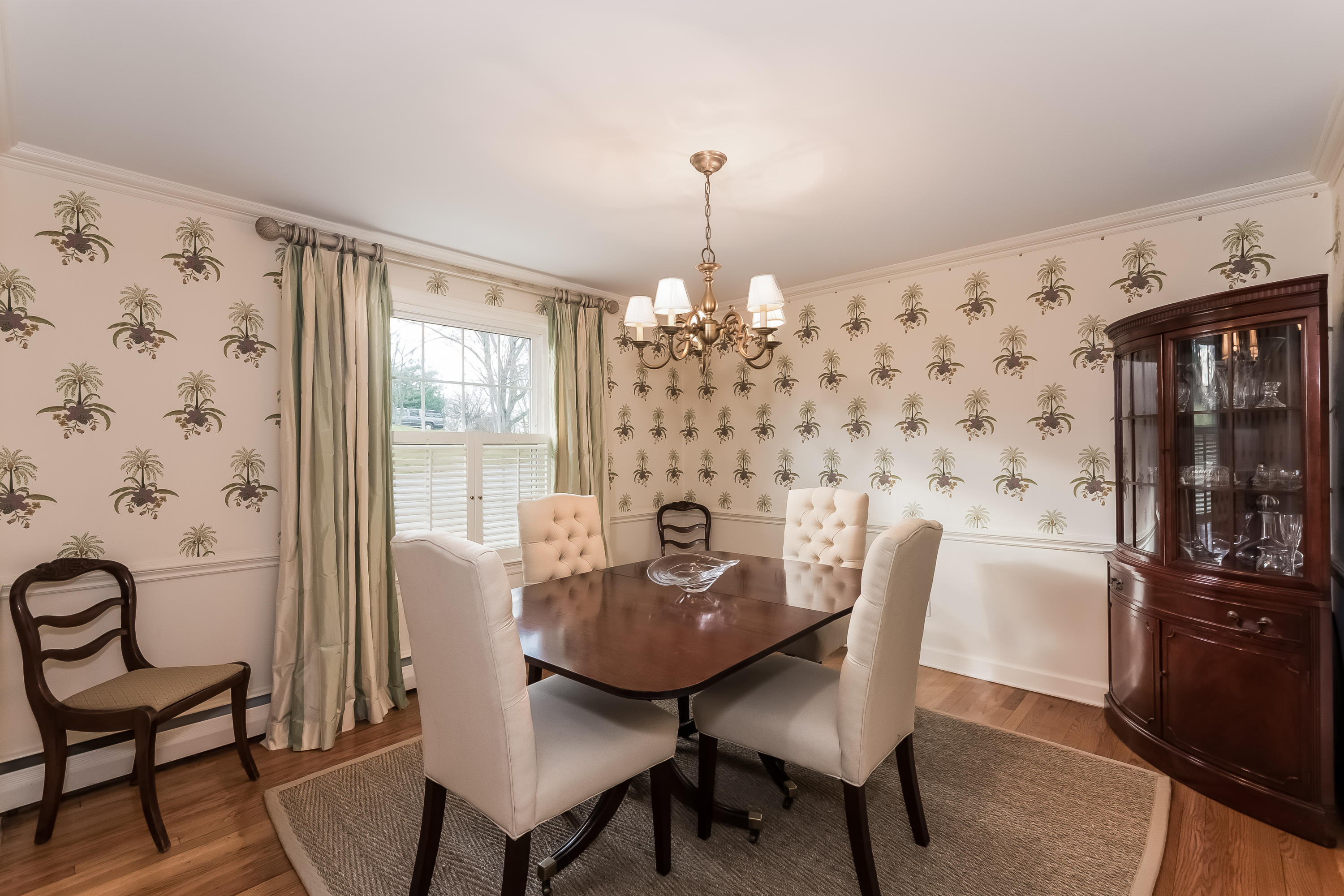 15 Wilson Ridge Road Darien, CT 06820 - Photo 9 of 42 a view of a dining room with furniture and chandelier