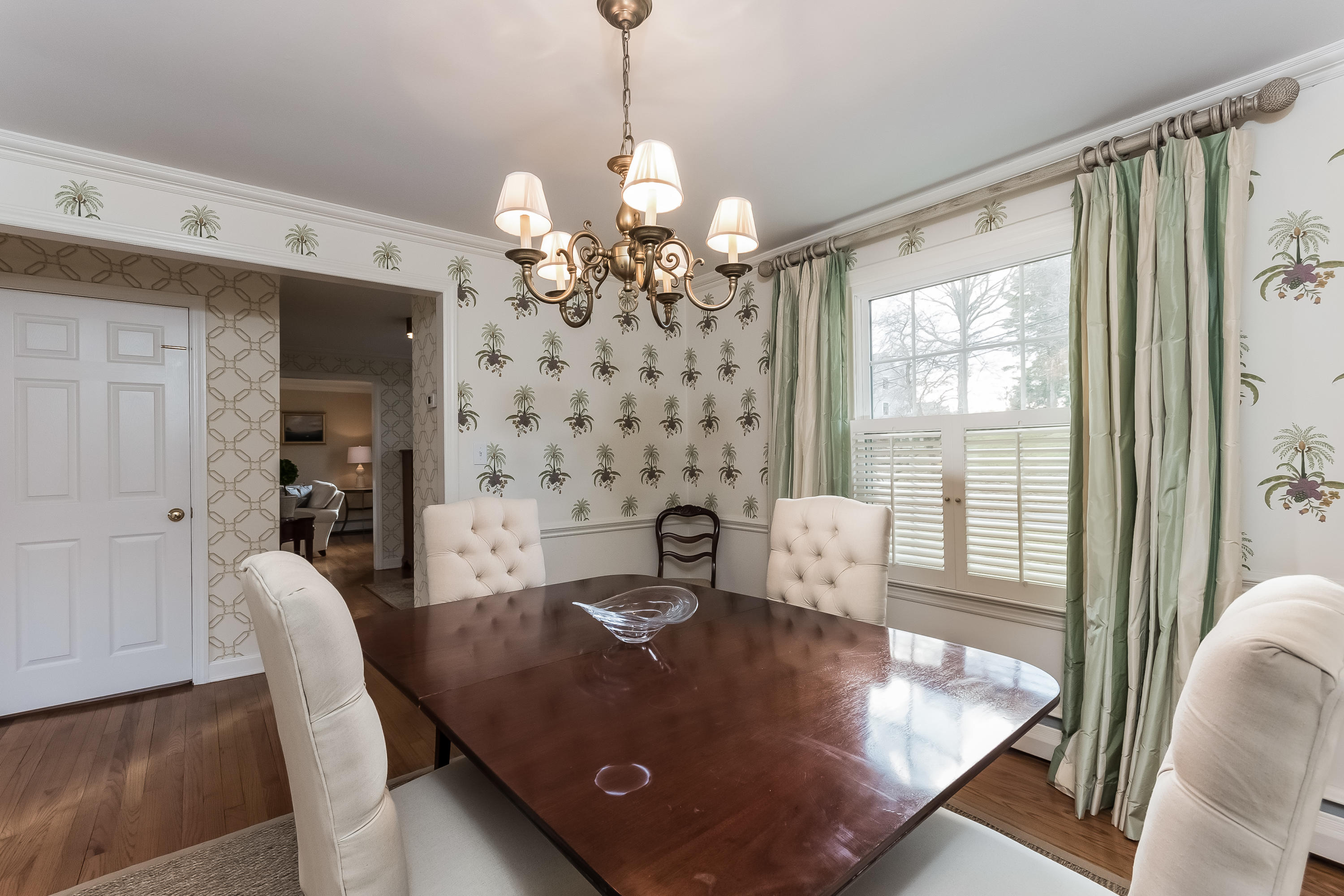 15 Wilson Ridge Road Darien, CT 06820 - Photo 10 of 42 a view of a dining room with furniture wooden floor and chandelier