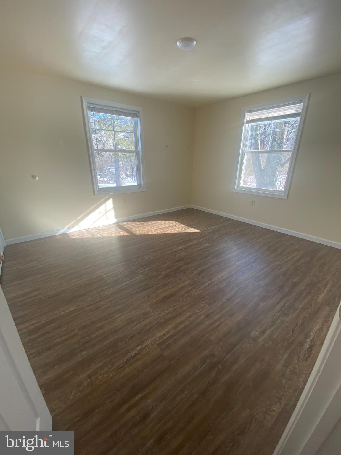71 Boddy Lane Keyser, WV 26726 - Photo 12 of 17 wooden floor in an empty room with a window