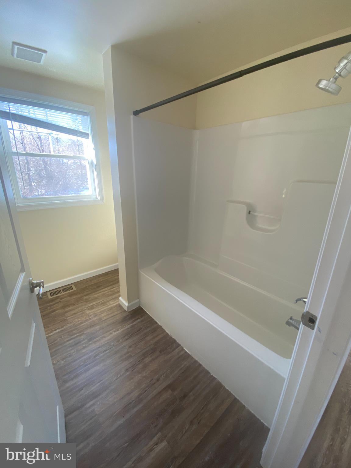 71 Boddy Lane Keyser, WV 26726 - Photo 13 of 17 a bathroom with a bathtub and a shower