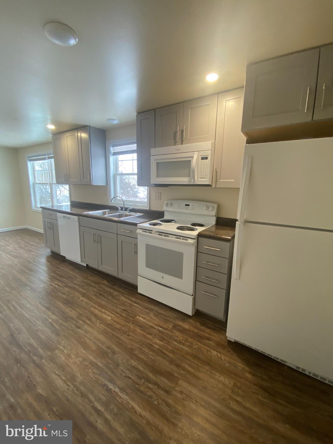 71 Boddy Lane Keyser, WV 26726 - Photo 4 of 17 a kitchen with stainless steel appliances granite countertop a stove a sink and a refrigerator