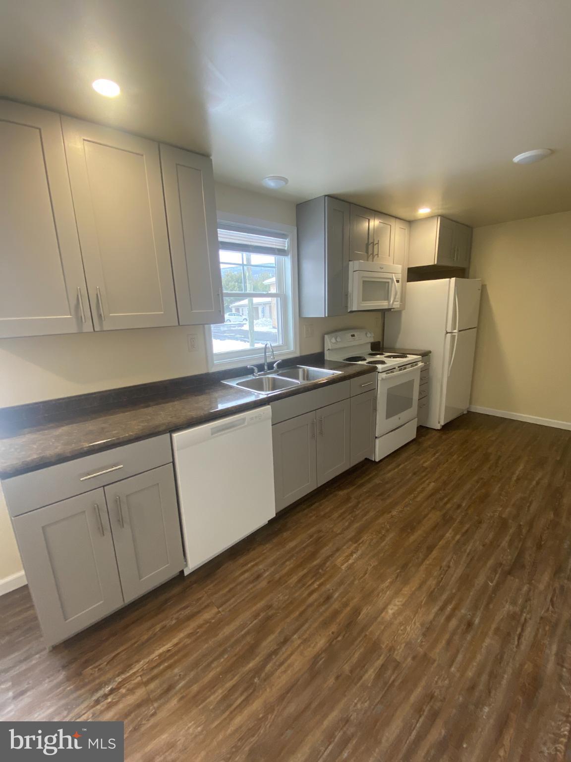 71 Boddy Lane Keyser, WV 26726 - Photo 5 of 17 a kitchen with stainless steel appliances granite countertop a sink and cabinets