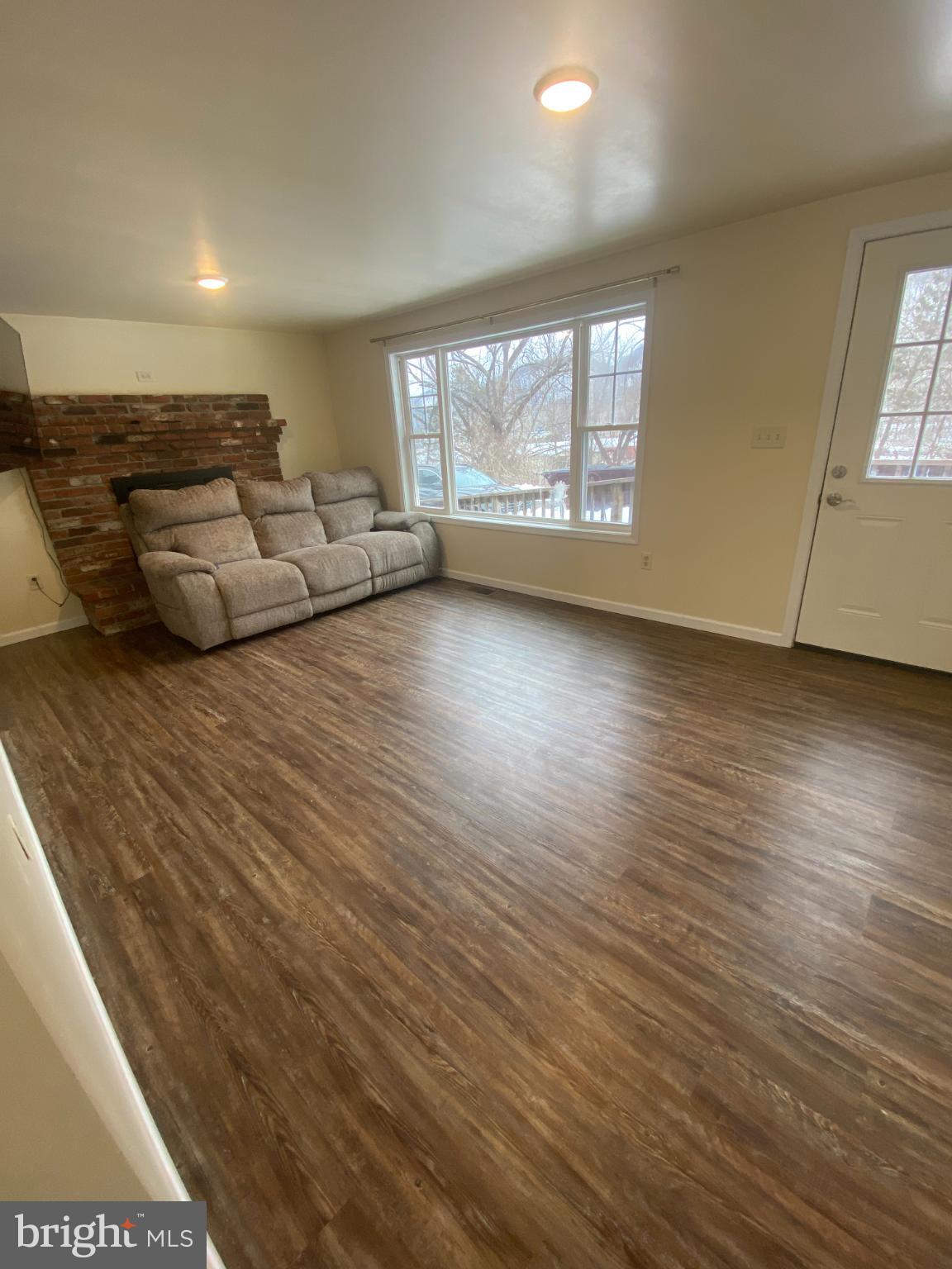 71 Boddy Lane Keyser, WV 26726 - Photo 8 of 17 a living room with furniture and a large window