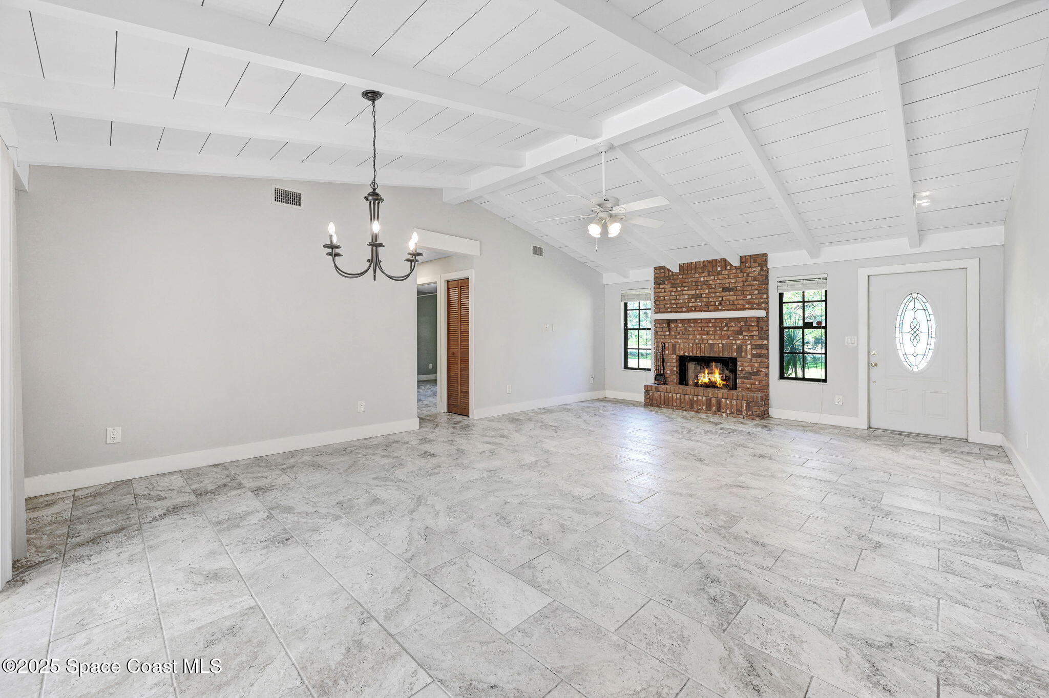 3301 Grant Road Grant-Valkaria, FL 32949 - Photo 11 of 56 a view of a livingroom with a fireplace