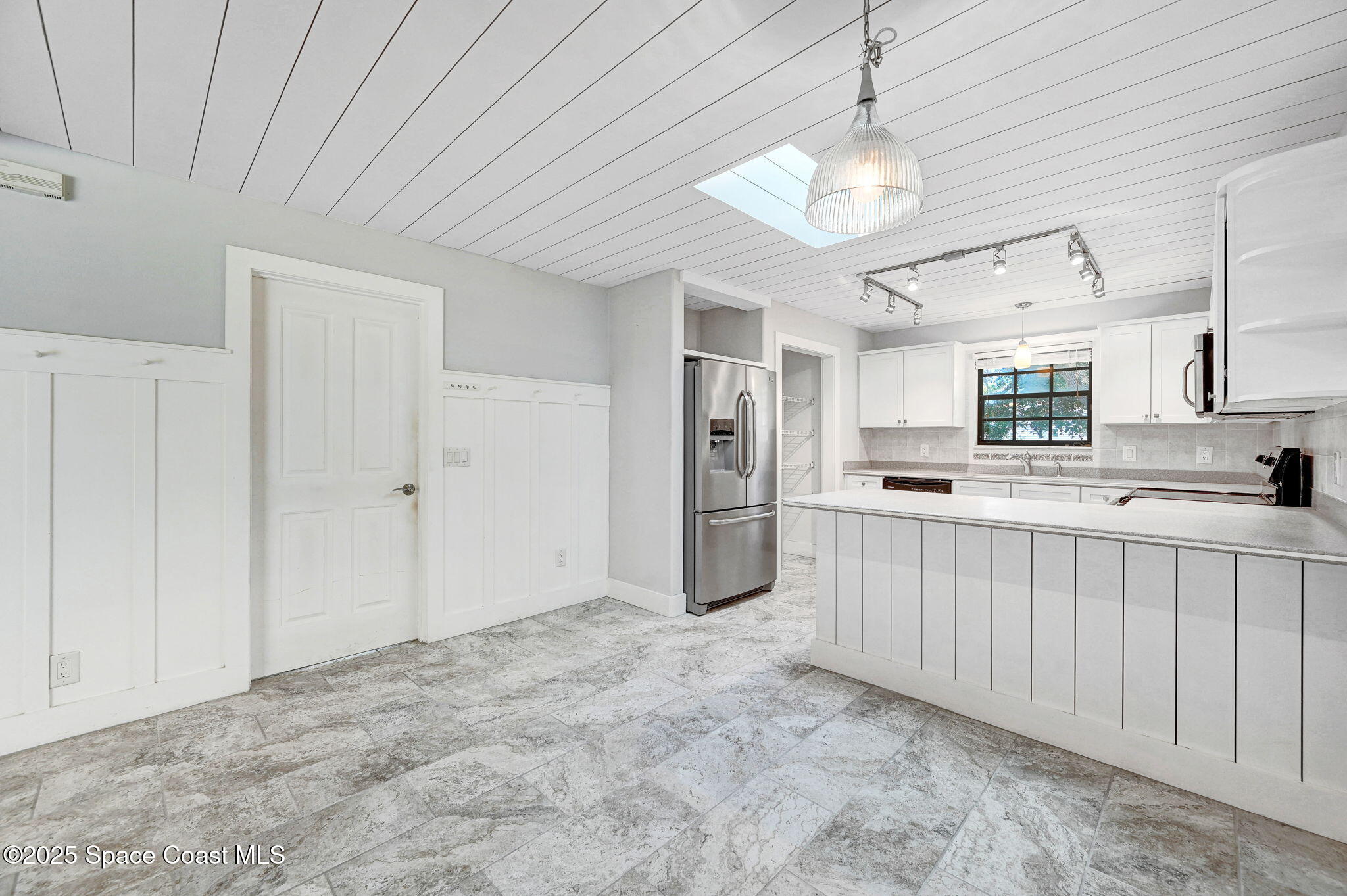 3301 Grant Road Grant-Valkaria, FL 32949 - Photo 14 of 56 a view of a kitchen with a sink and cabinets