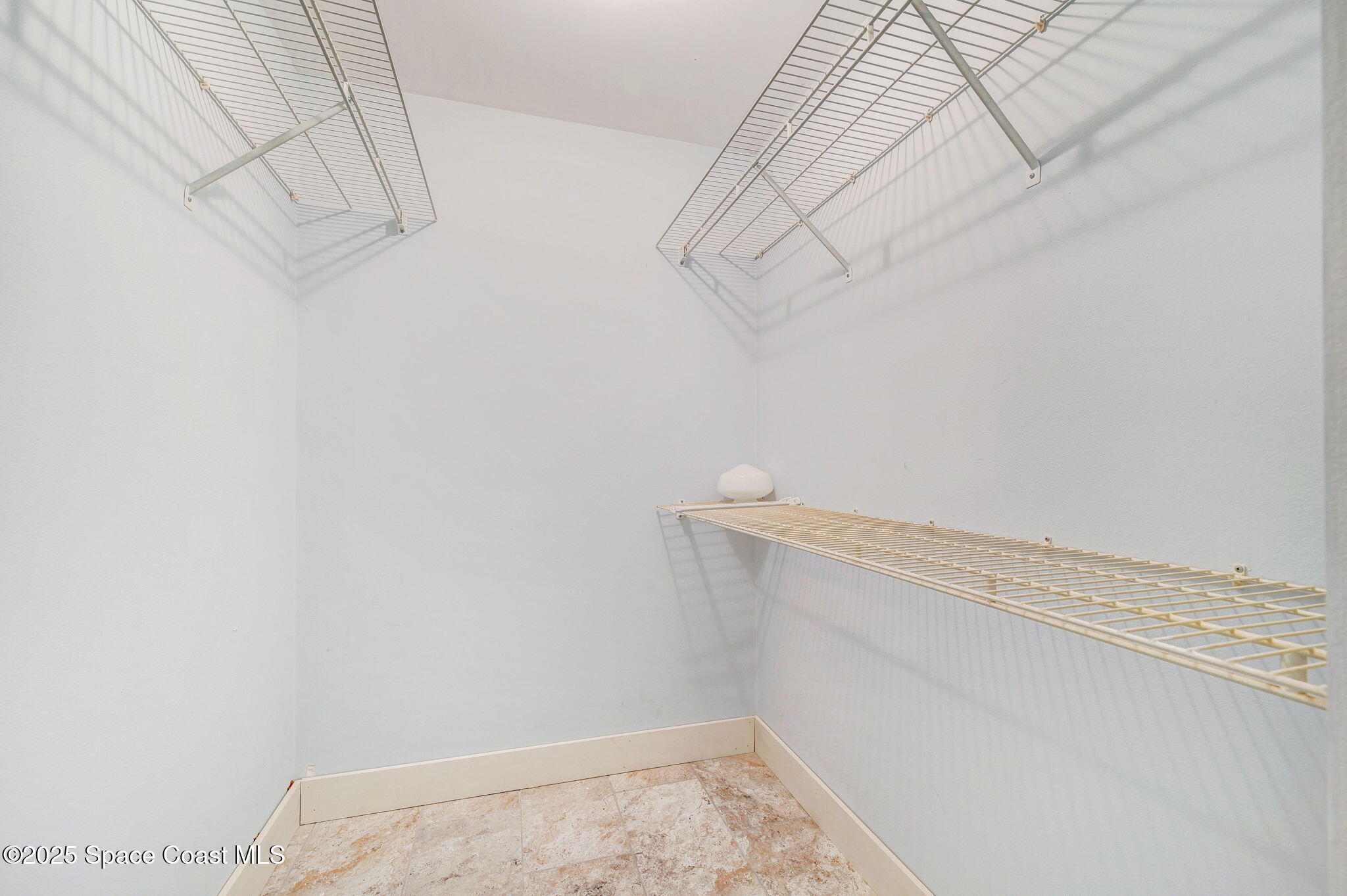 3301 Grant Road Grant-Valkaria, FL 32949 - Photo 24 of 56 a view of a room with racks on the wall