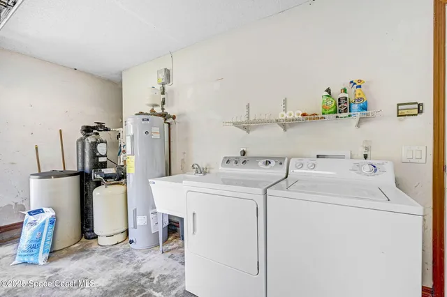 a view of backyard of house with green space