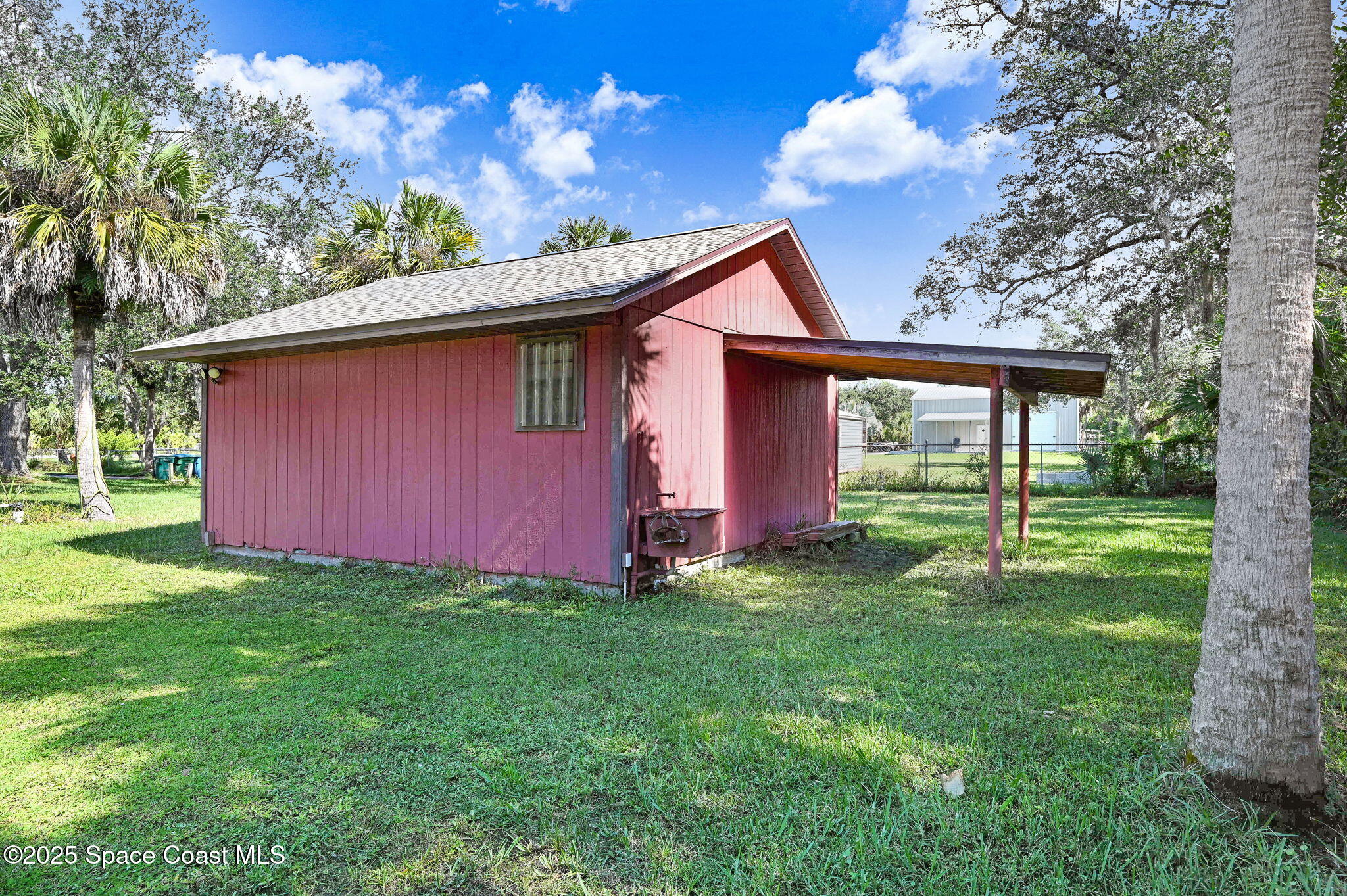 3301 Grant Road Grant-Valkaria, FL 32949 - Photo 35 of 56 a view of backyard of house with green space