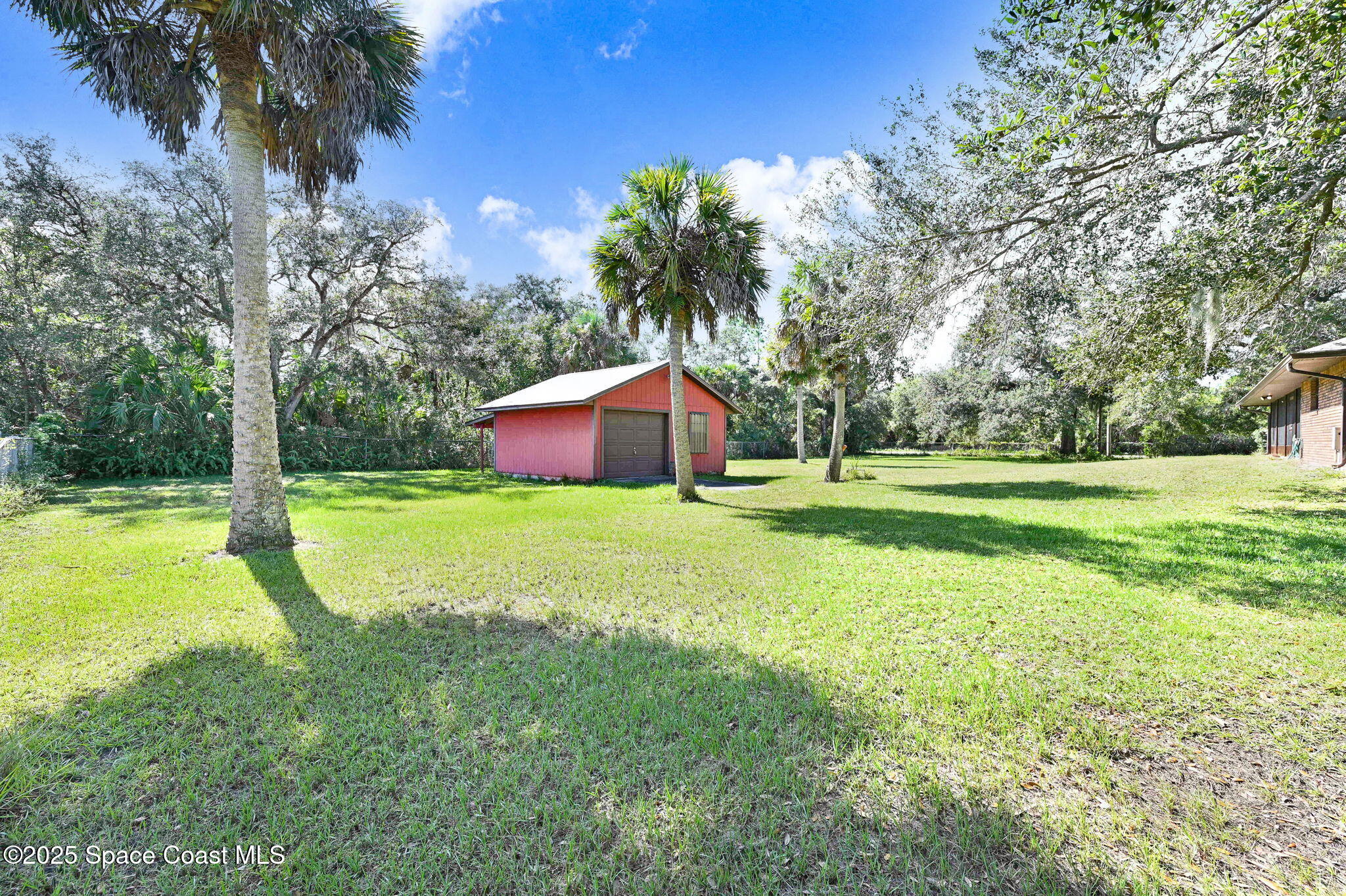 3301 Grant Road Grant-Valkaria, FL 32949 - Photo 37 of 56 a view of a house with yard and tree s