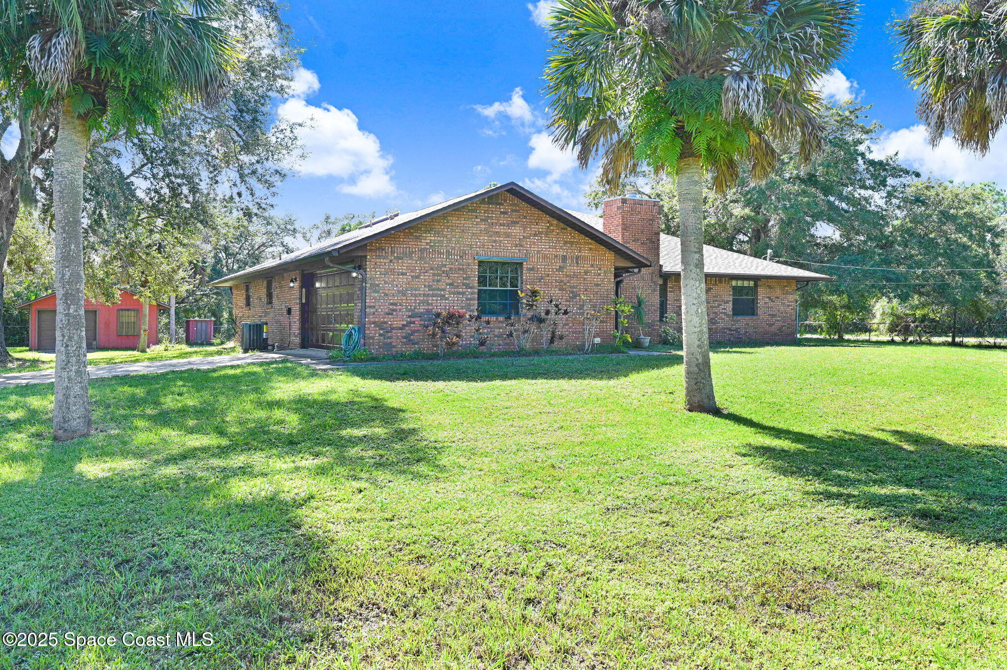 3301 Grant Road Grant-Valkaria, FL 32949 - Photo 46 of 56 a front view of house with yard and green space