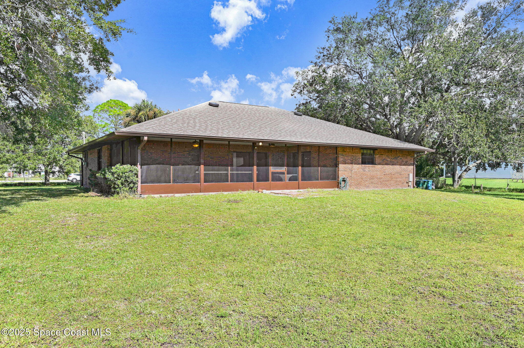3301 Grant Road Grant-Valkaria, FL 32949 - Photo 48 of 56 a front view of a house with a garden