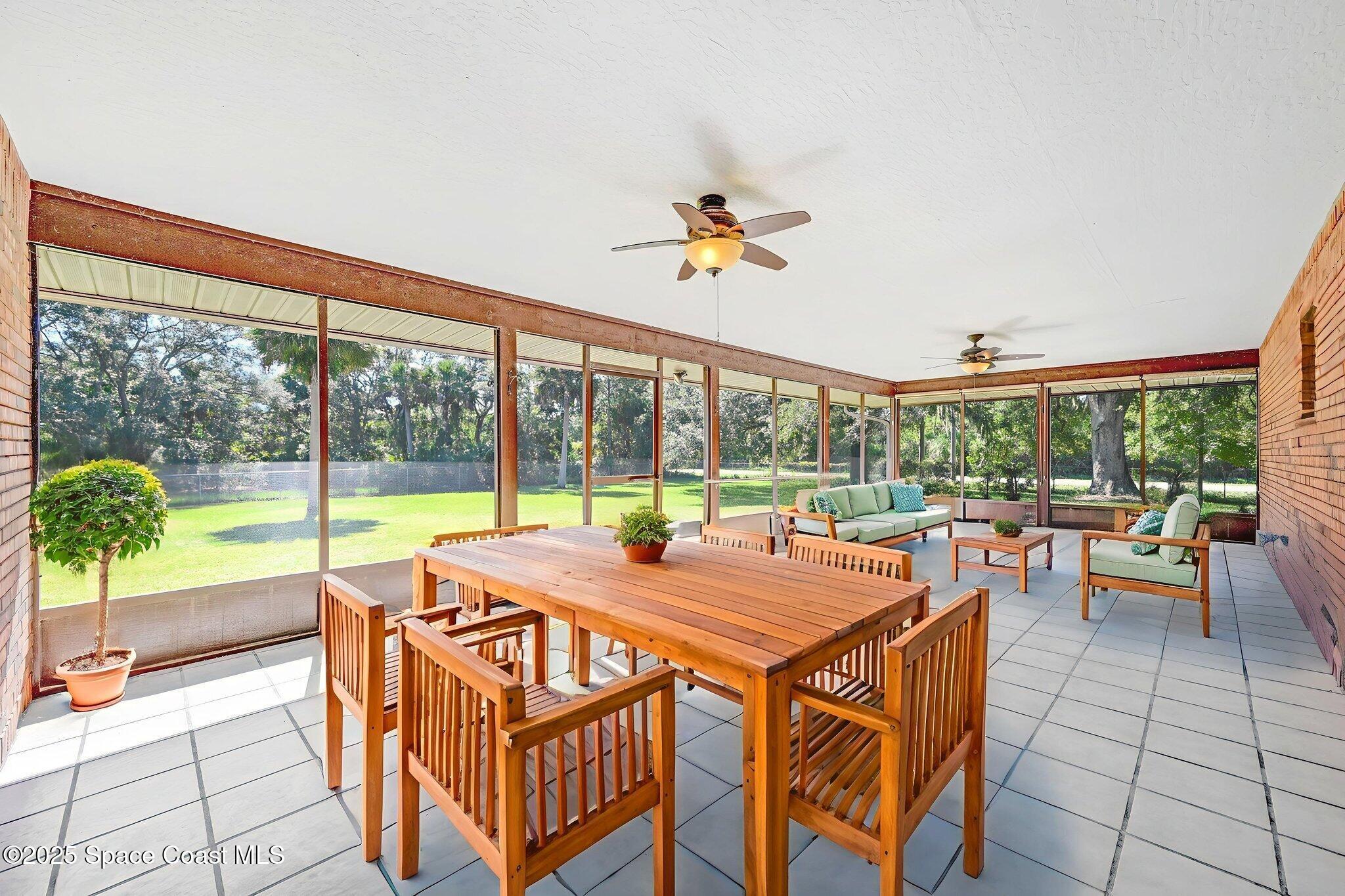 3301 Grant Road Grant-Valkaria, FL 32949 - Photo 4 of 56 a view of a dining room with furniture window and outside view