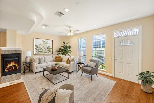 a living room with furniture and a fireplace