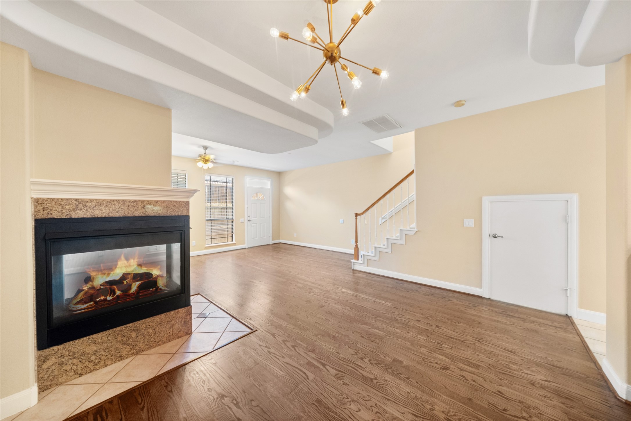 2406 Calumet Street Houston, TX 77004 - Photo 18 of 37 a view of an empty room with wooden floor fireplace and a window
